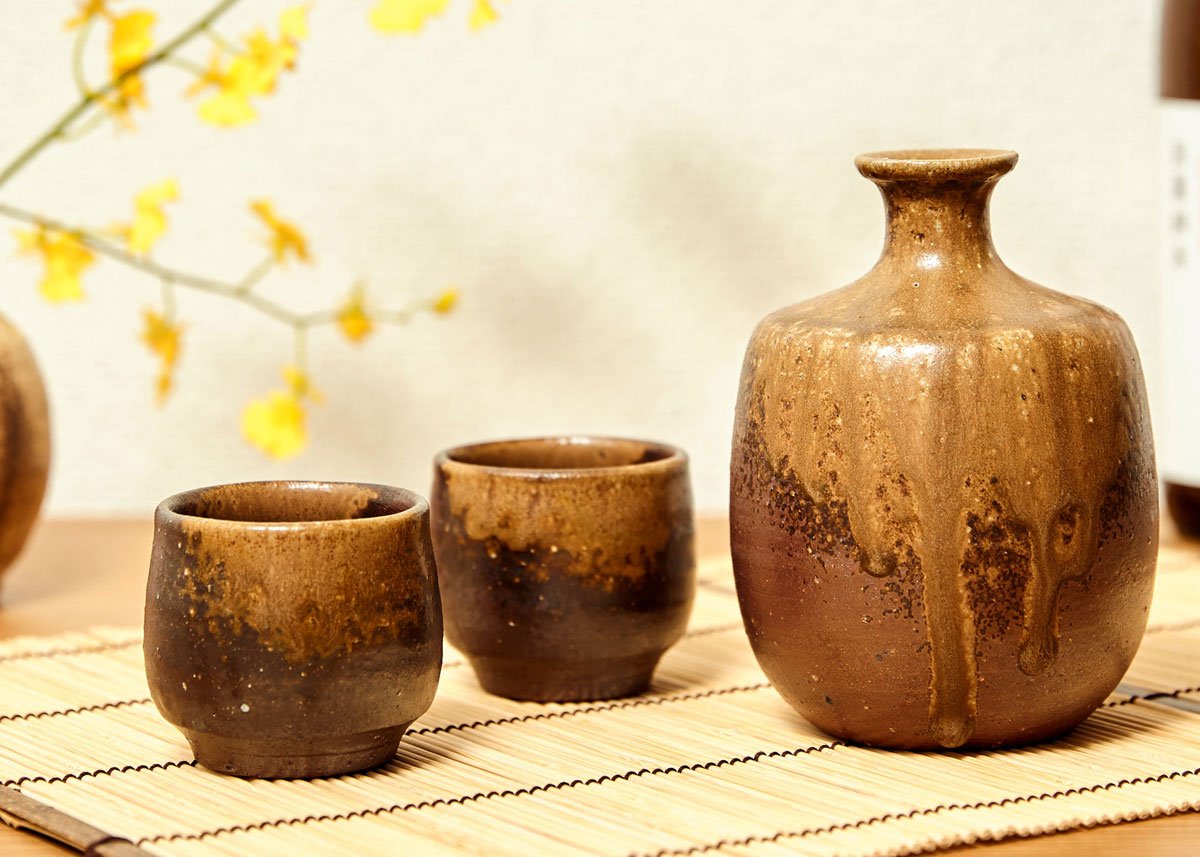 Japanese Glazed Ceramic Sake Set with Oriental Style Blue Ocean Waves Design Includes Serving Carafe and 4 Sake Cups