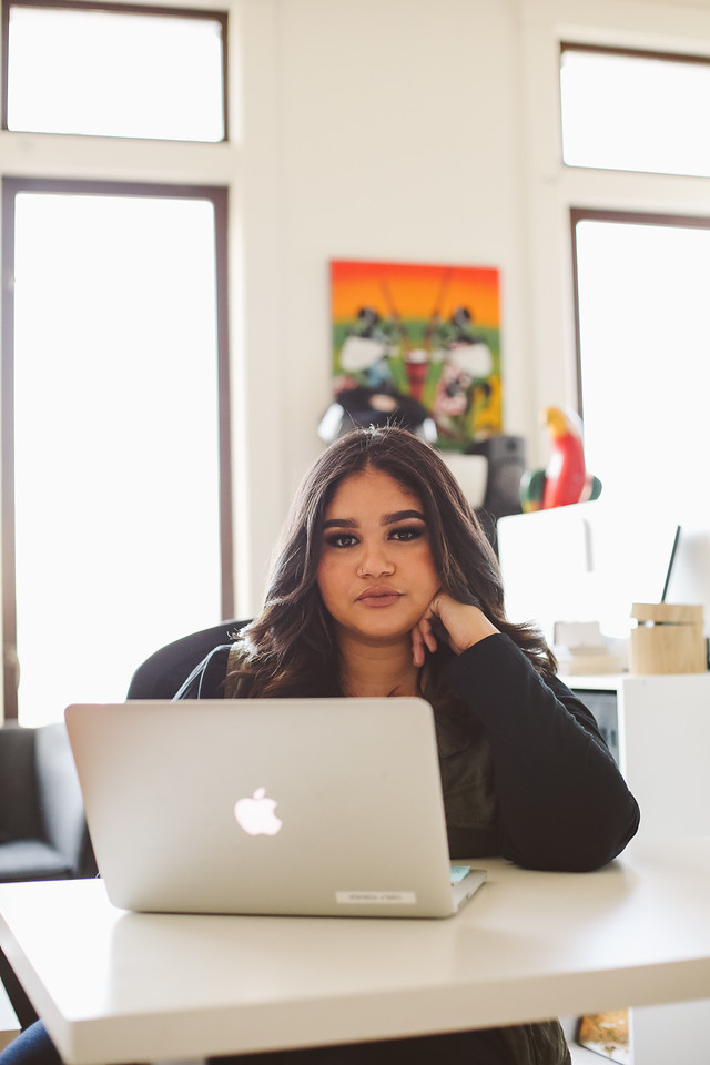 Girl with laptop sitting at desk