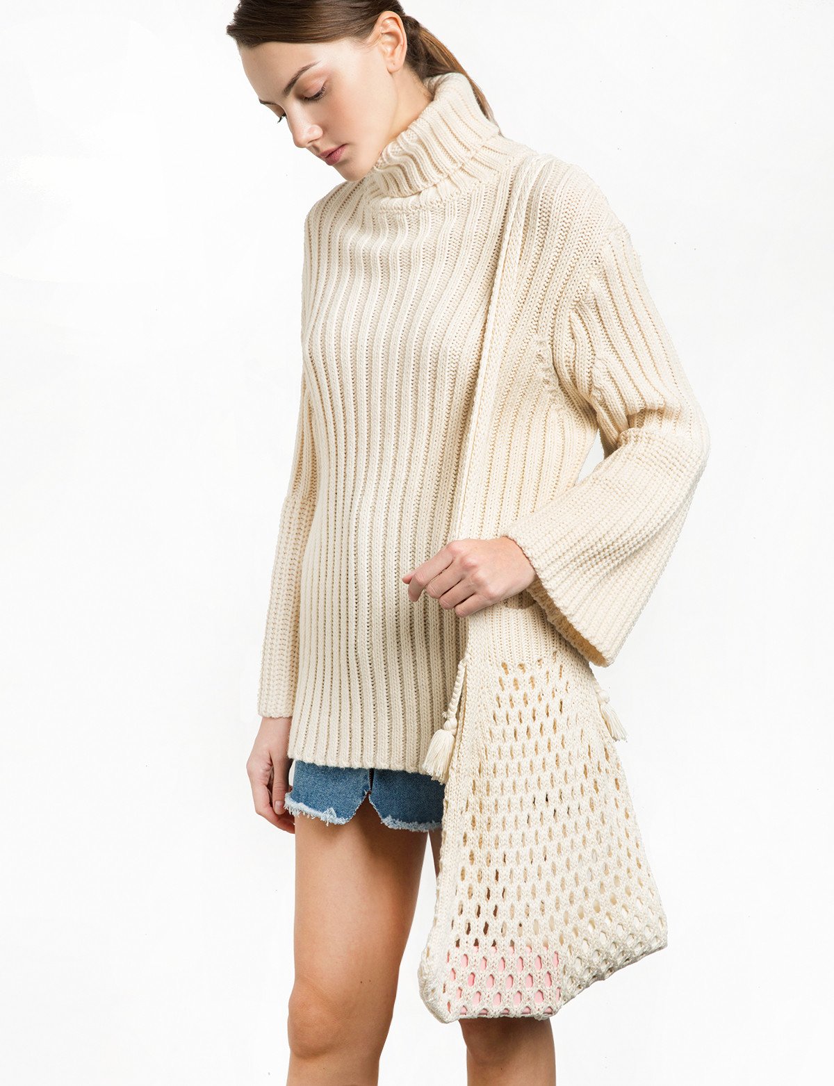 This version is a subtle yet refreshing twist on the original. With longer straps and thicker netting, it offers a slightly more exaggerated statement while still retaining all of the care-free charm. Find it at Pixie Market here . 