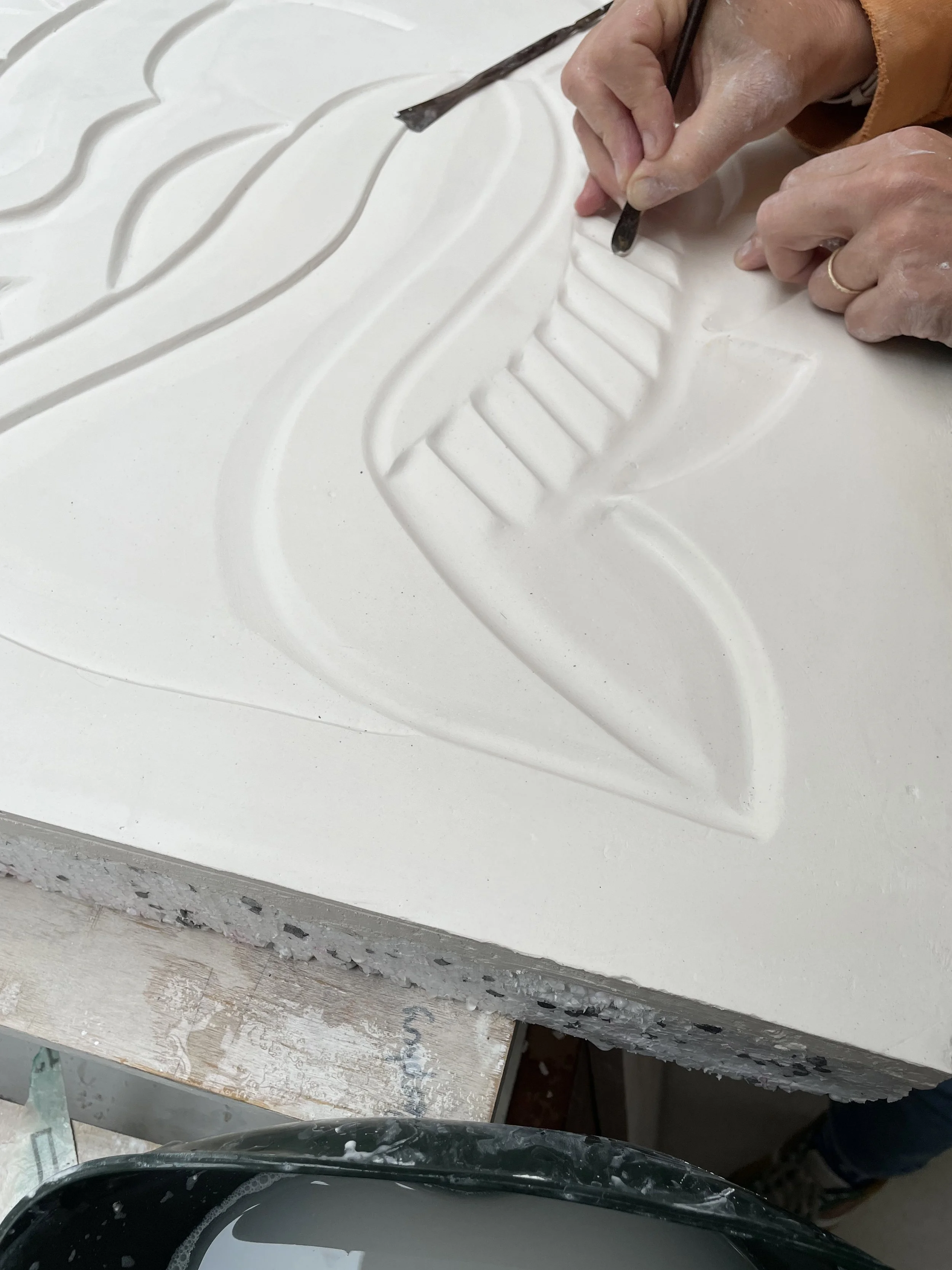 Helen Johannesson perfecting the surface of the mural