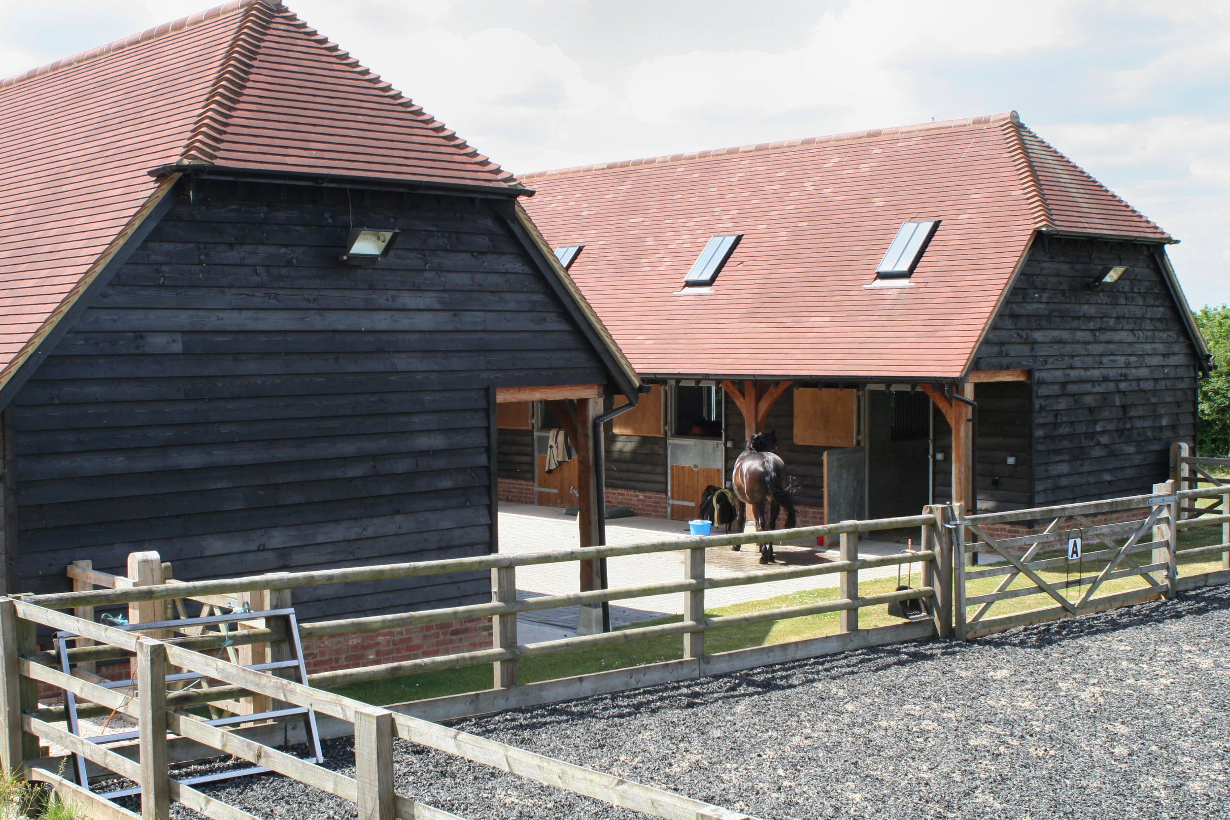 Loose boxes, machinery storage and hay/tack room