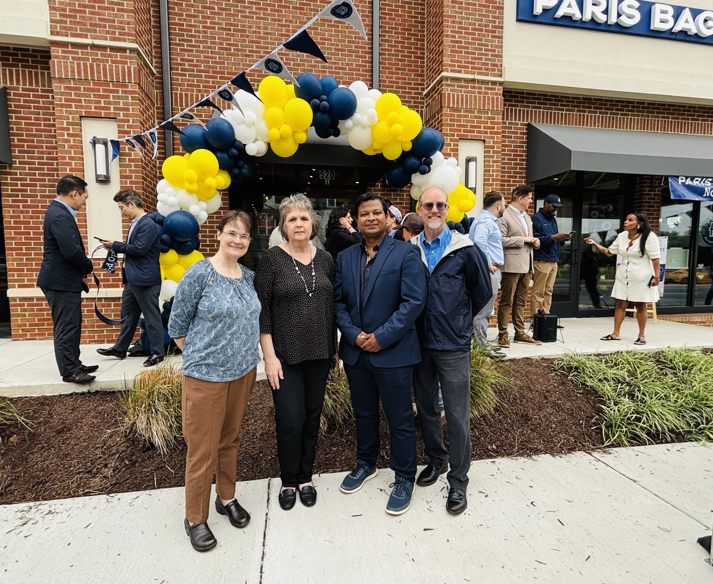 Carol attending a ribbon cutting for a local business.