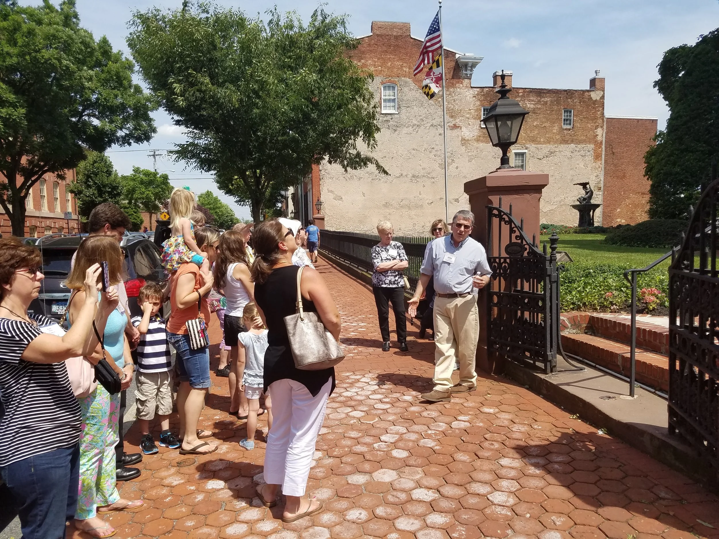 Walking Tour of Downtown Frederick, stopped in front of Keeney & Basford, the former Trail Mansion