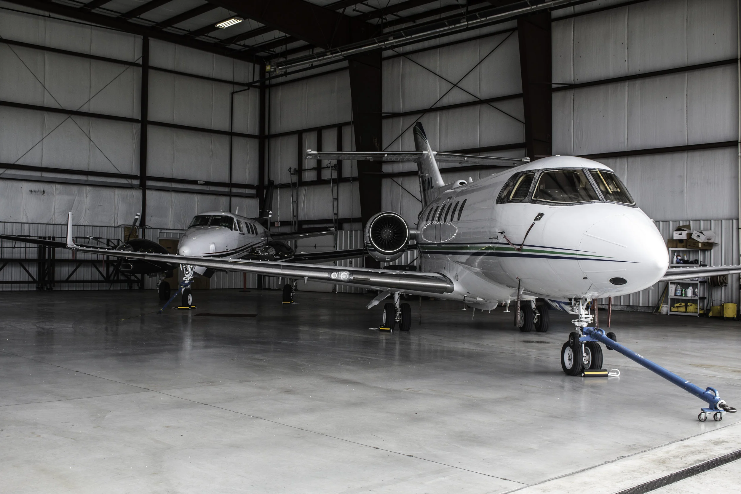 white planes inside airport facility for storage
