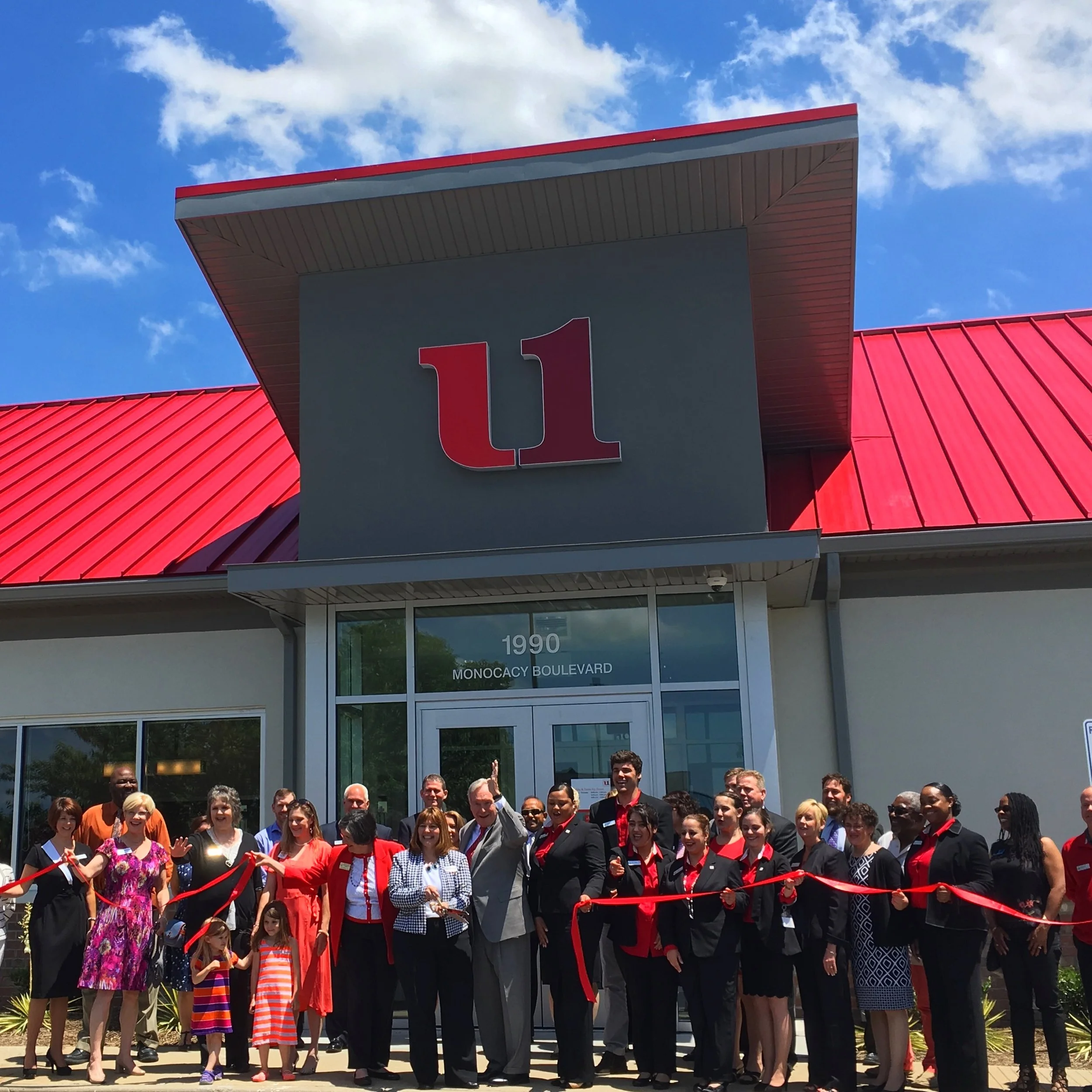group cutting ribbon.JPG