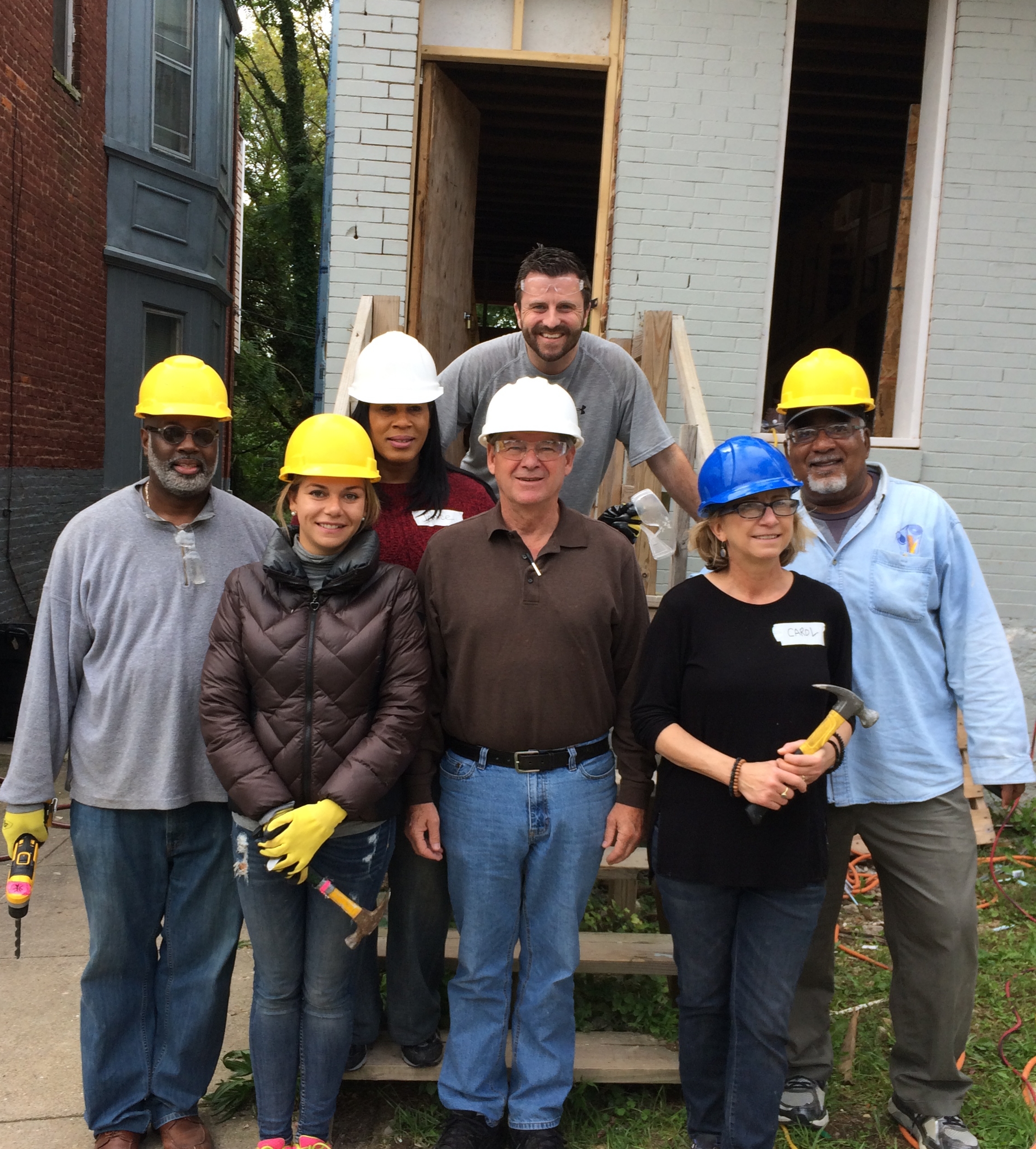 DHCD staff helping with Habitat for Humanity project