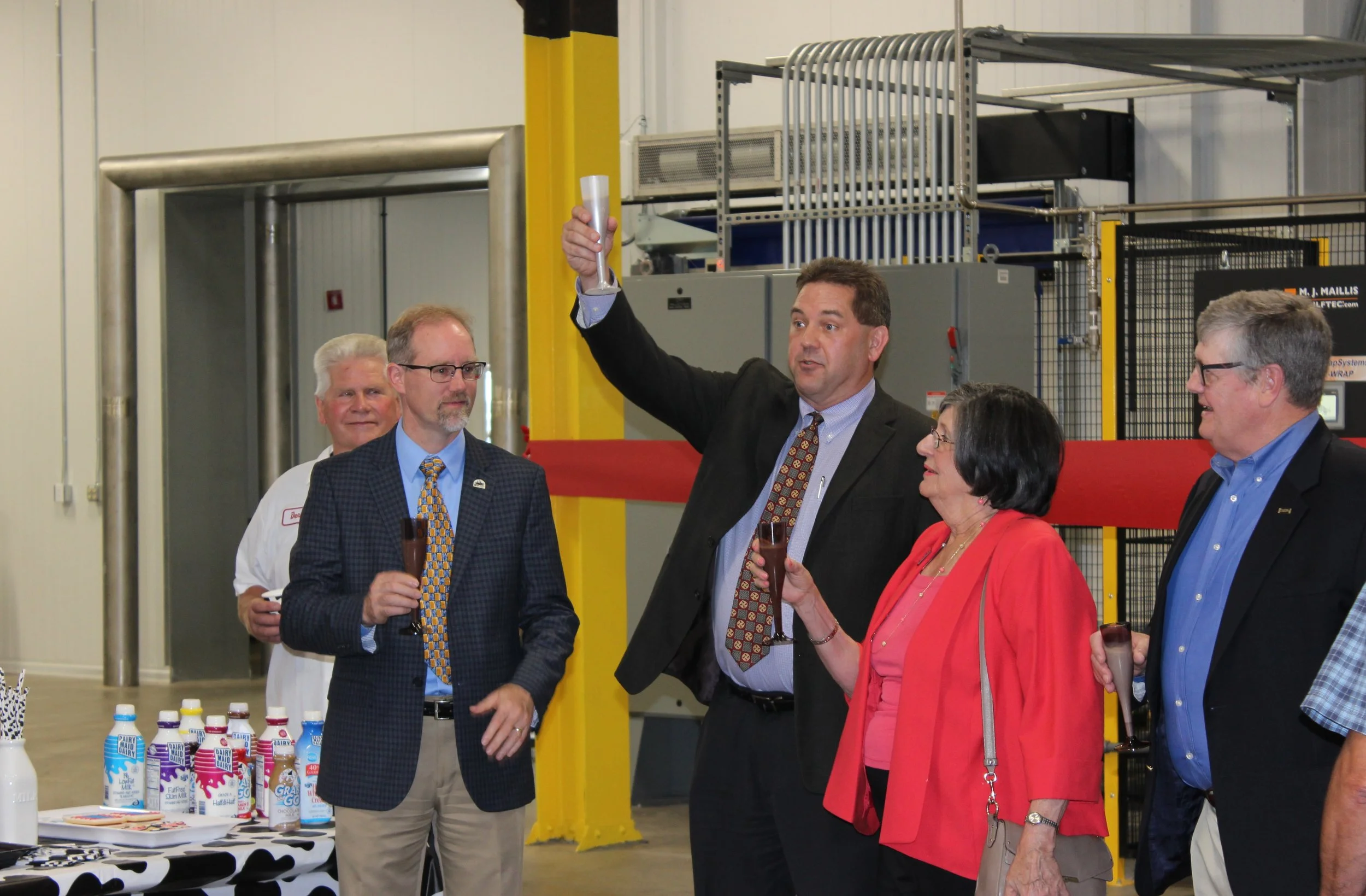 group making toast with glasses raised.JPG