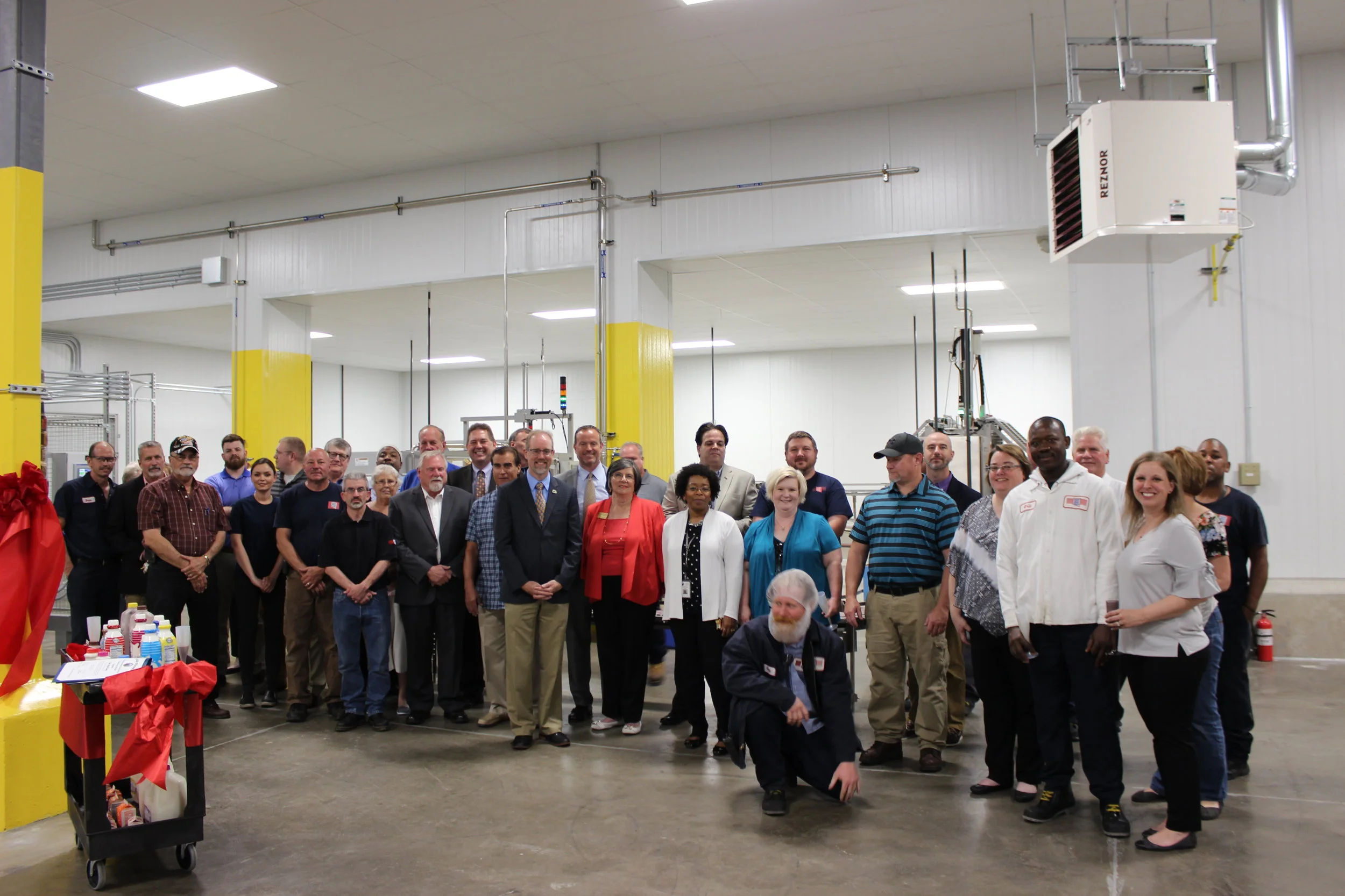 group photo inside warehouse.JPG