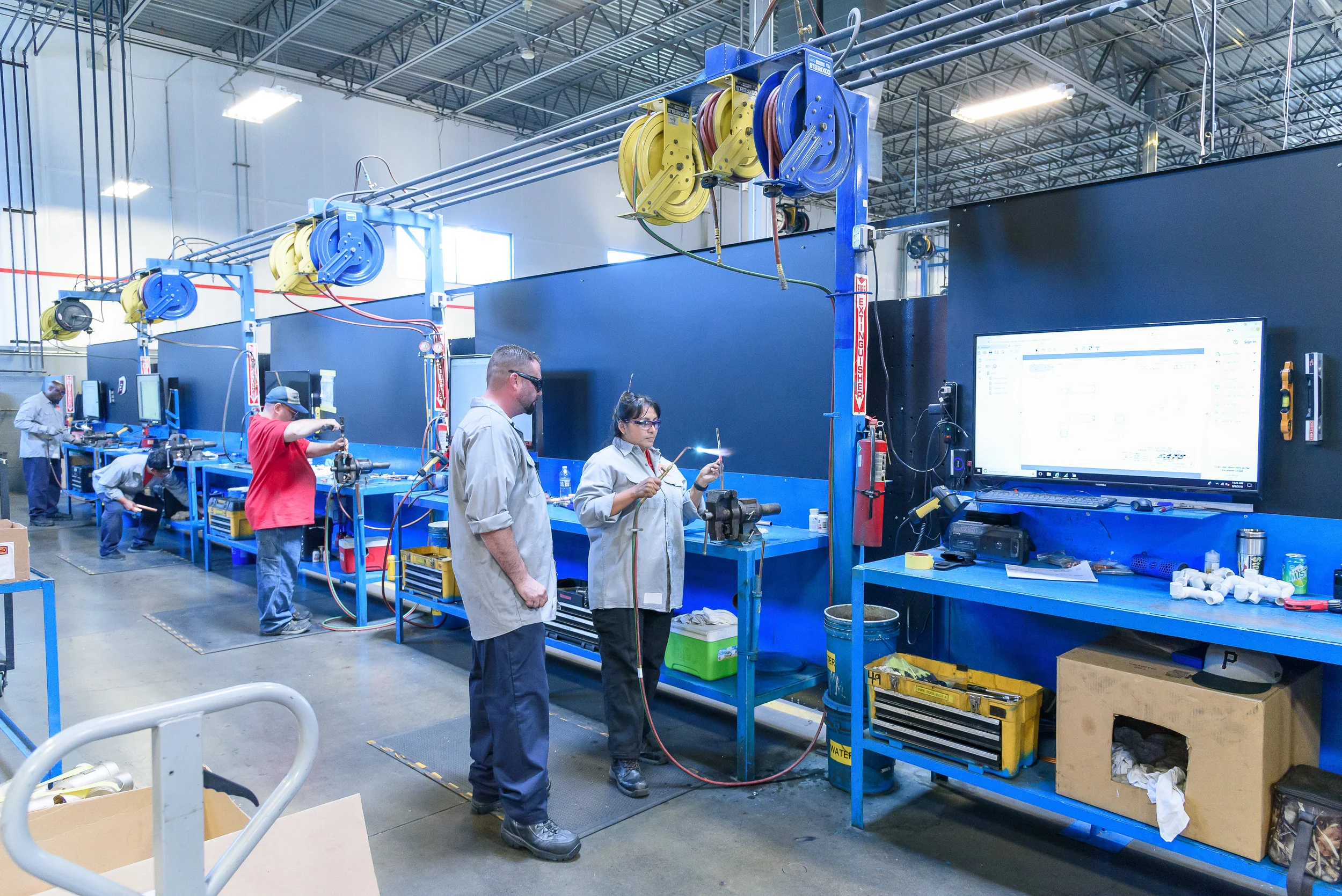 man and woman working on equipment.jpg