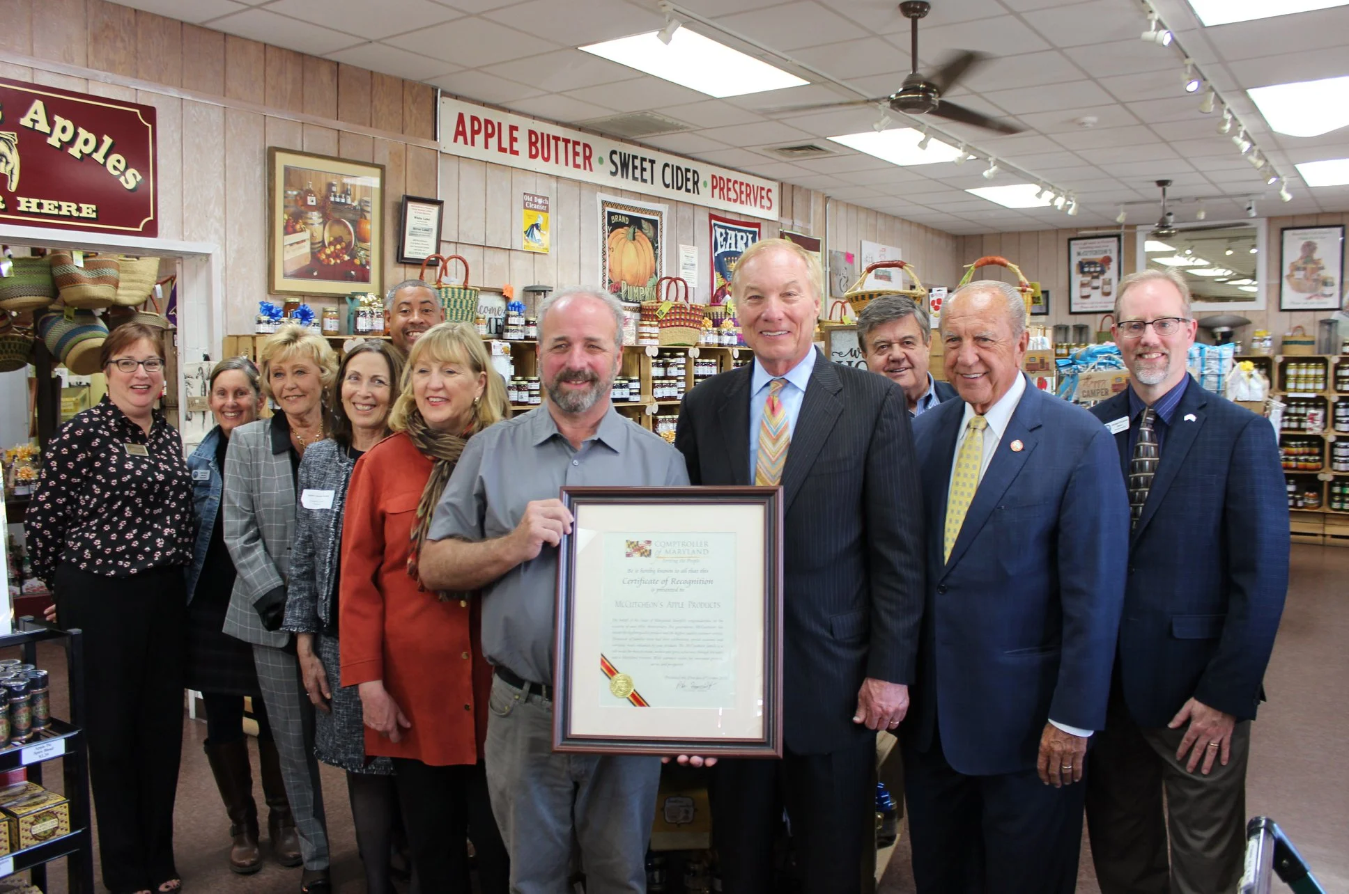 Tamar and other local representatives celebrating McCutcheon’s 80th anniversary with Comptroller Peter Franchot