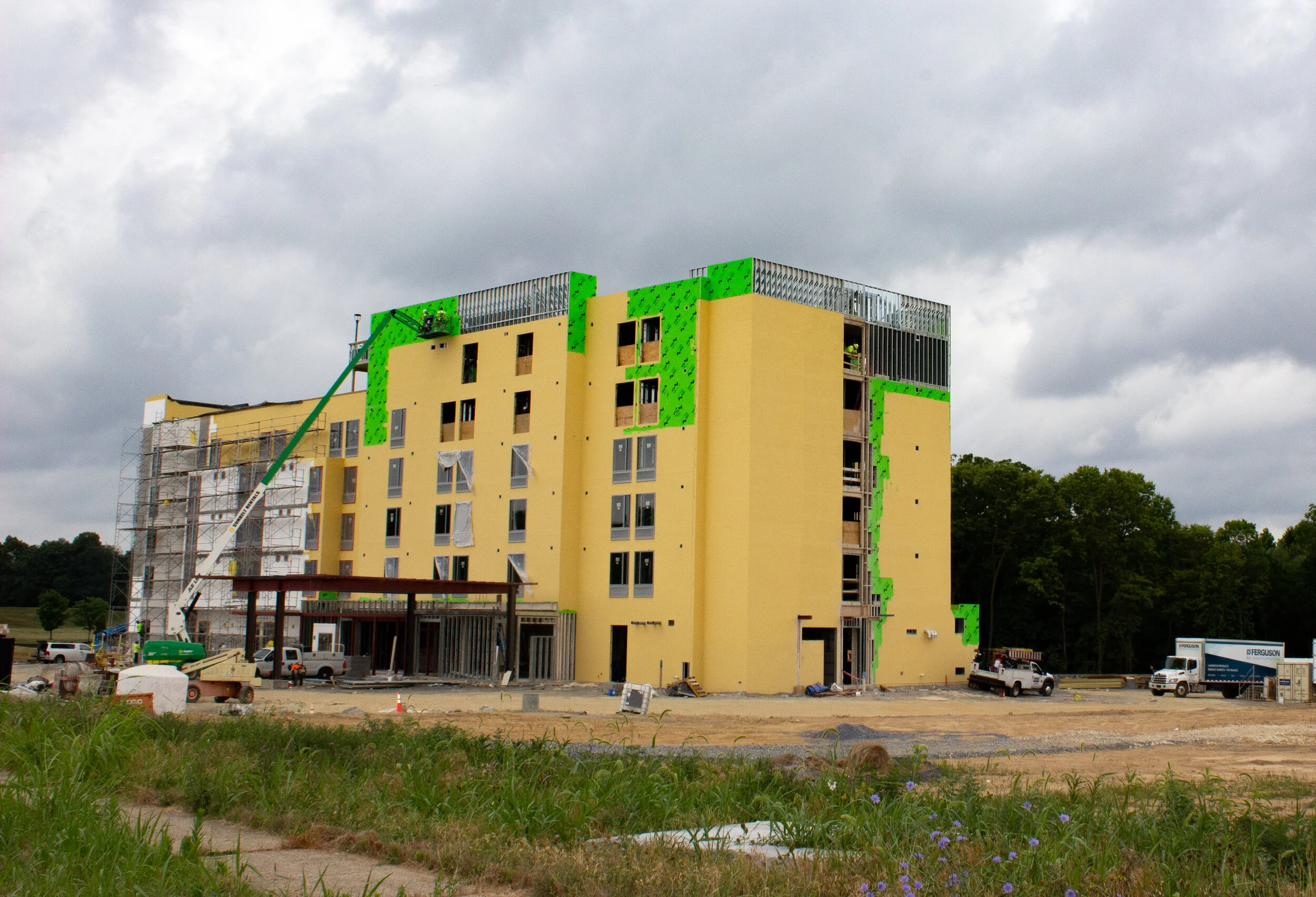 A vibrant yellow building adorned with green painted details..jpg