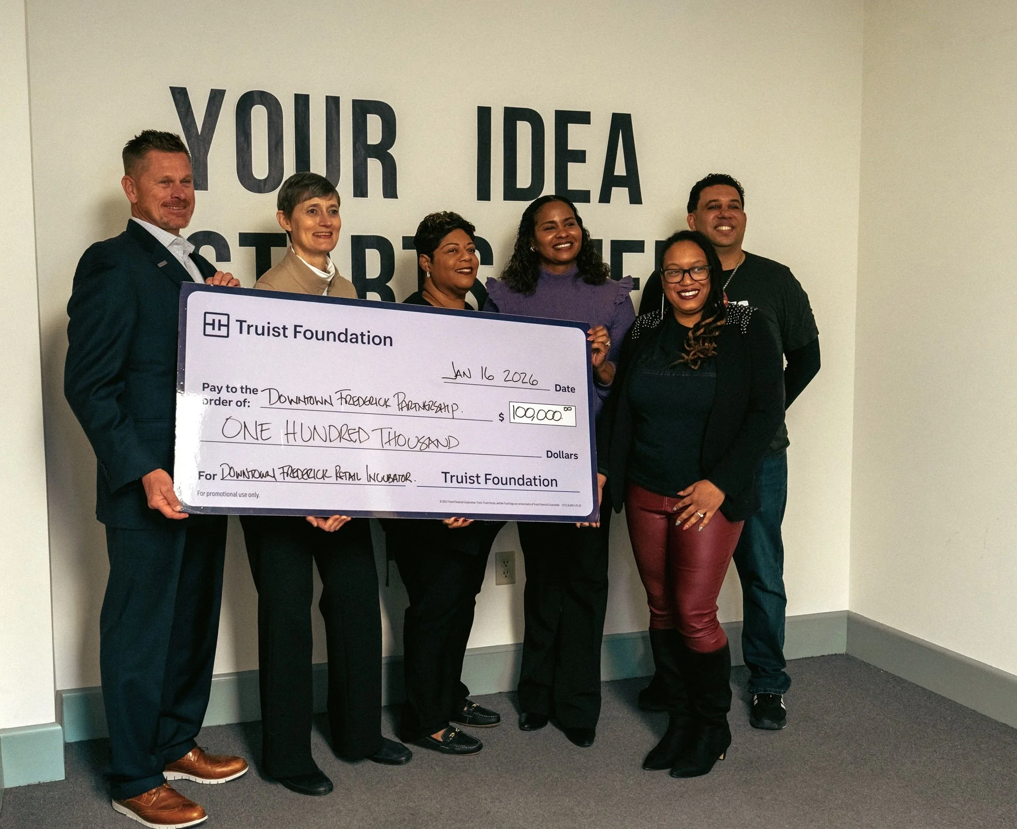  Group photo with check from Truist Foundation. 