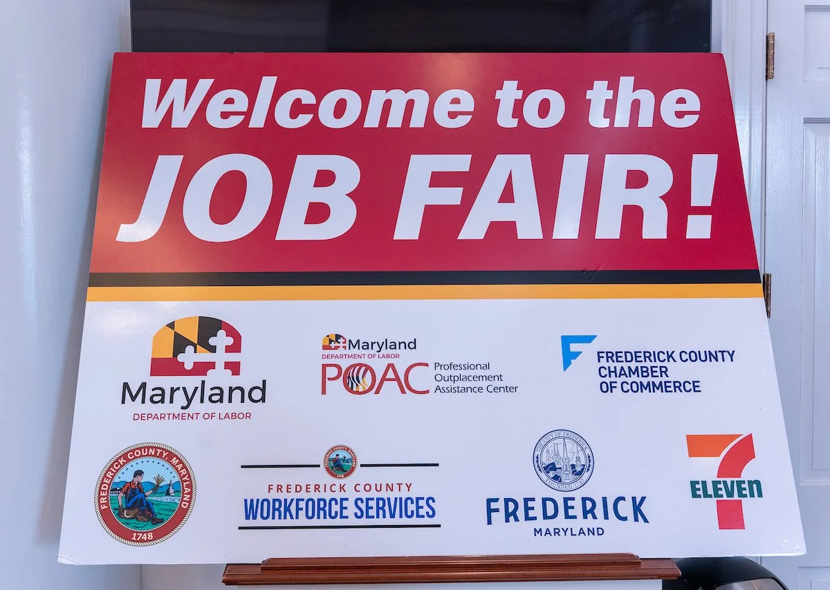 poster that reads "welcome to the job fair!" in white font with red background with company logos underneath