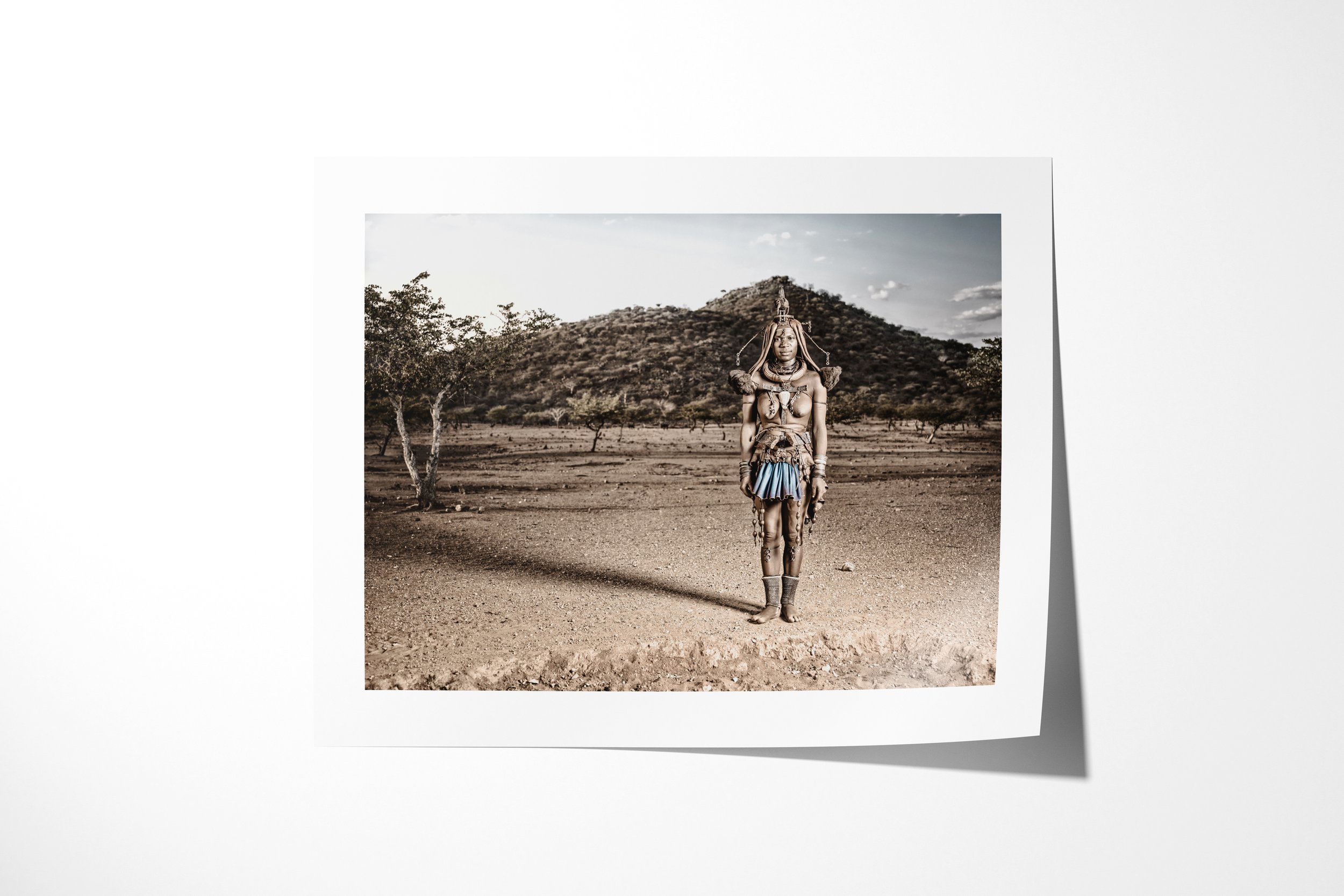 Fine art paper print of Twahenwa, showing Twahenwa in elaborate ceremonial dress standing in open country before low hills.