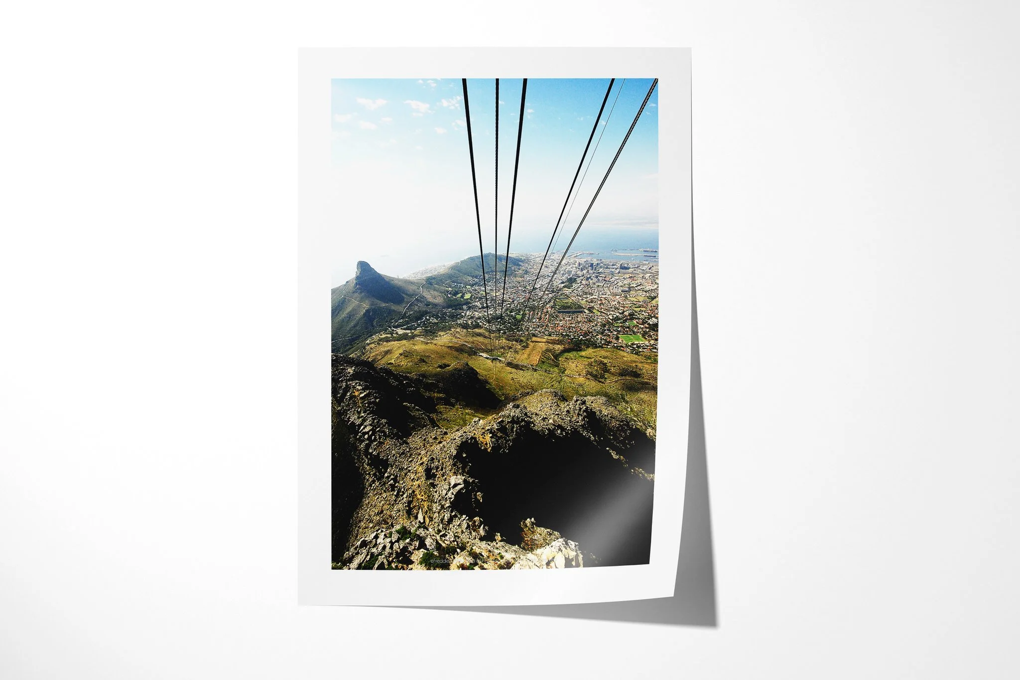 Fine art paper print of Cape Town, showing cable lines descending above Lion's Head, Cape Town's city bowl, harbour and Atlantic coast.