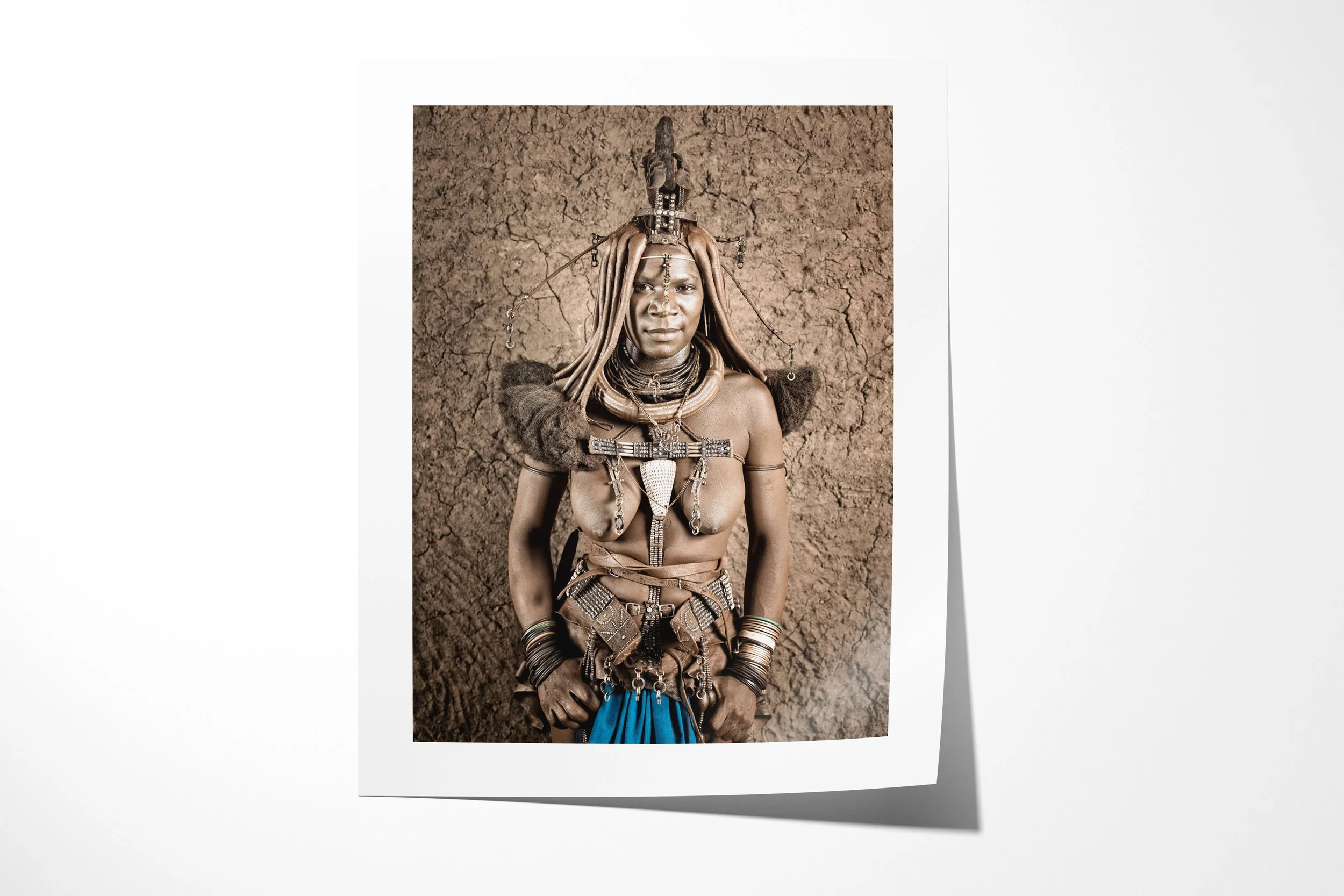 Fine art paper print of Twahenwa II, showing a close portrait of Twahenwa wearing an erembe headdress, otjize-dressed hair and layered jewellery.
