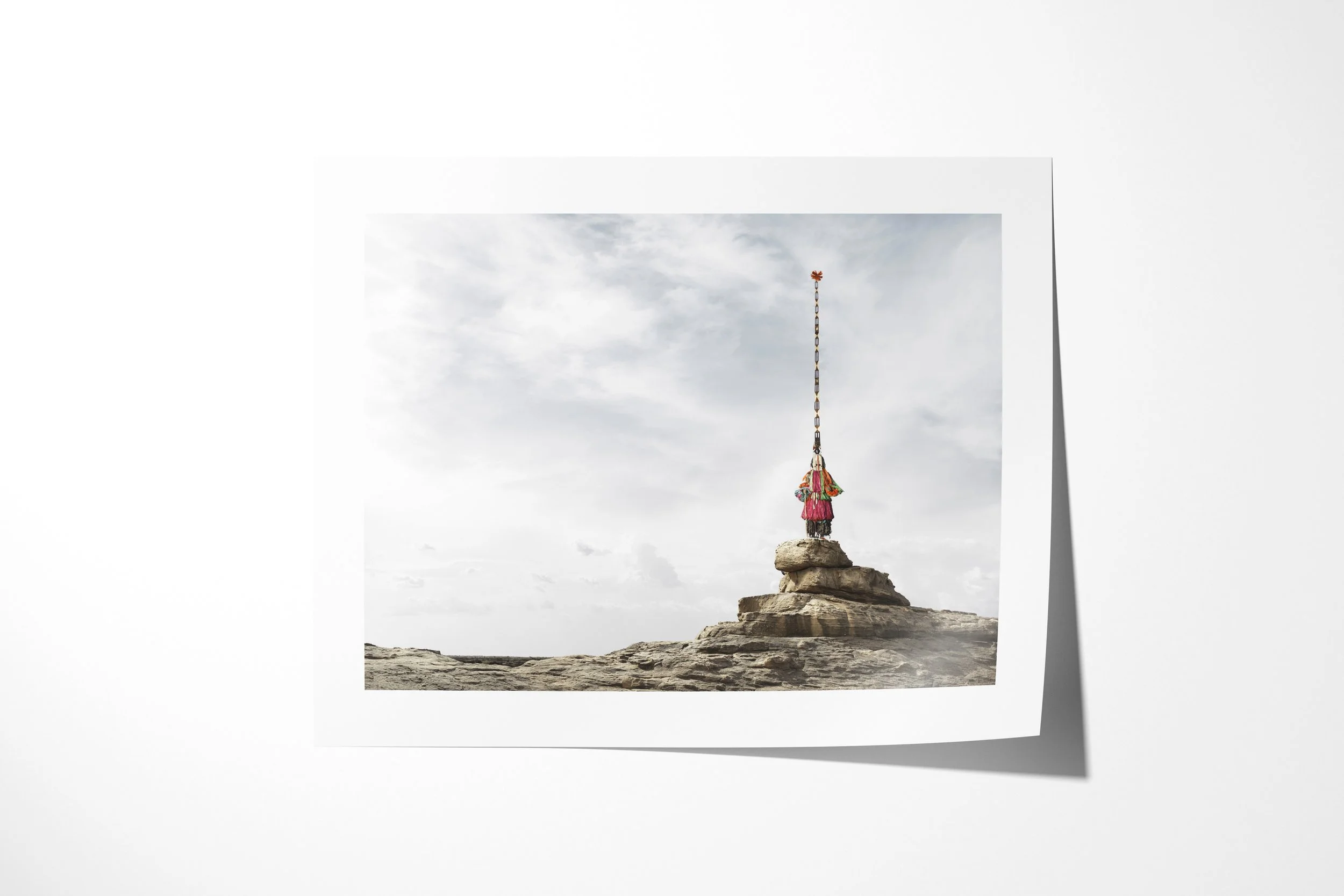 Fine art paper print of Sirige (Mask), showing a Dogon Sirige mask with an exceptionally tall vertical superstructure standing on a rock pinnacle.