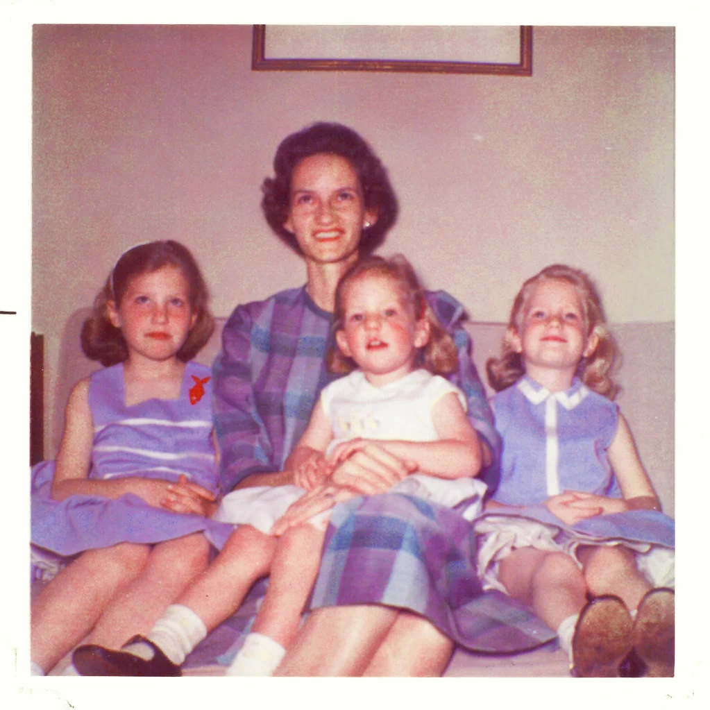 That's Momma (Ge) with Janelle on the left, Norah on the right and me, of course, on her lap.