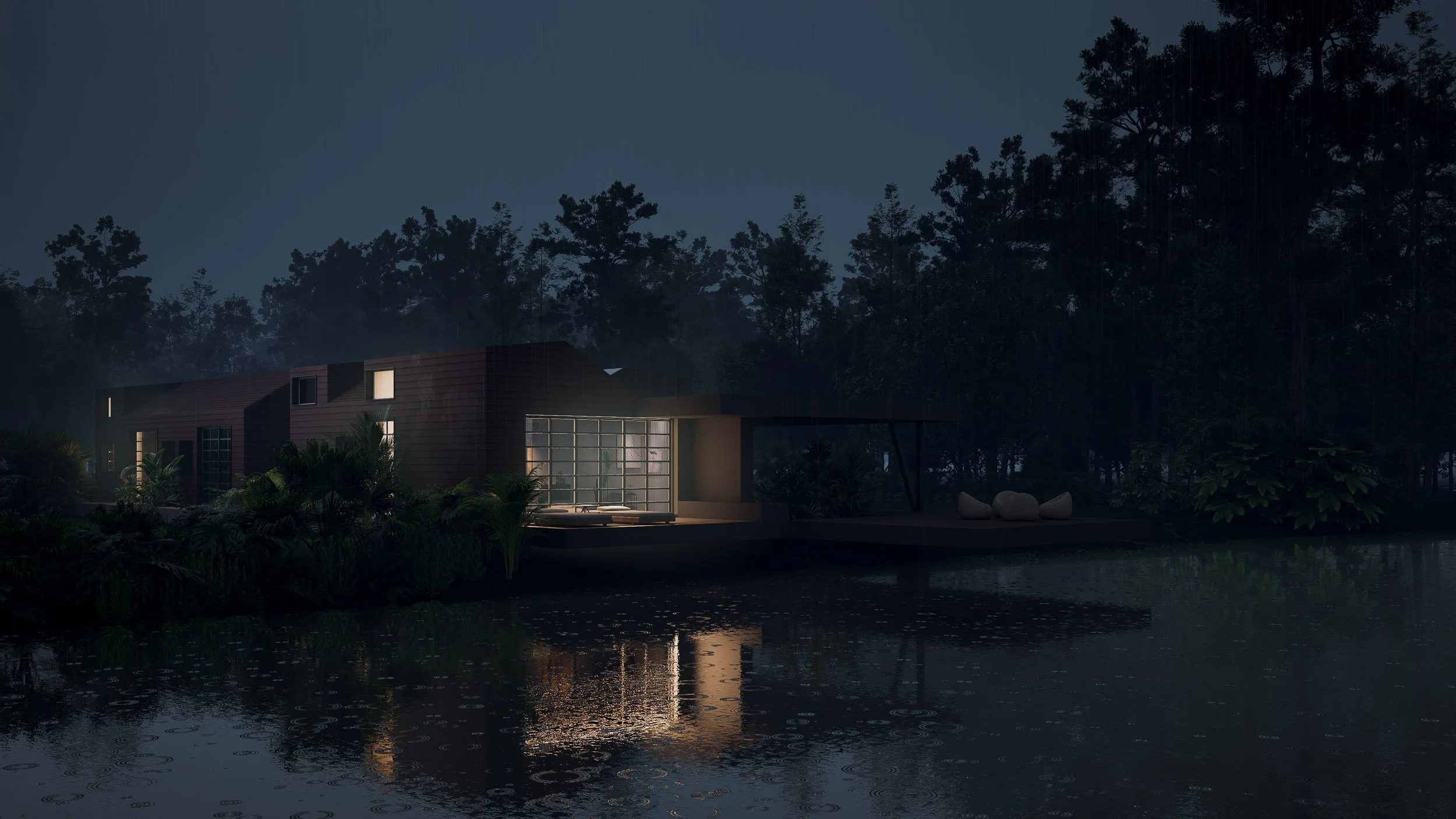 Casa moderna iluminada al atardecer junto a un lago con árboles en el fondo. Casa CAJÚ, ubicada en el Alto de Las Palmas en Medellín. Diseño arquitectónico por TOLEDO Estudio de Arquitectura.