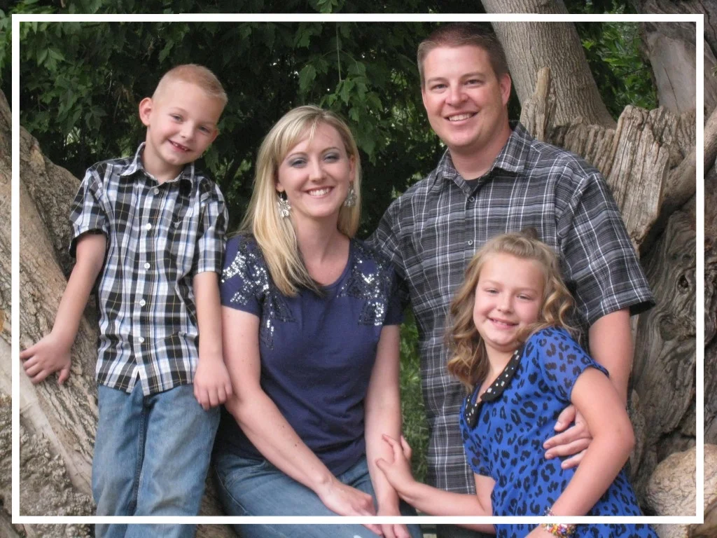 Officer Shaun Cowley and his wife and two children