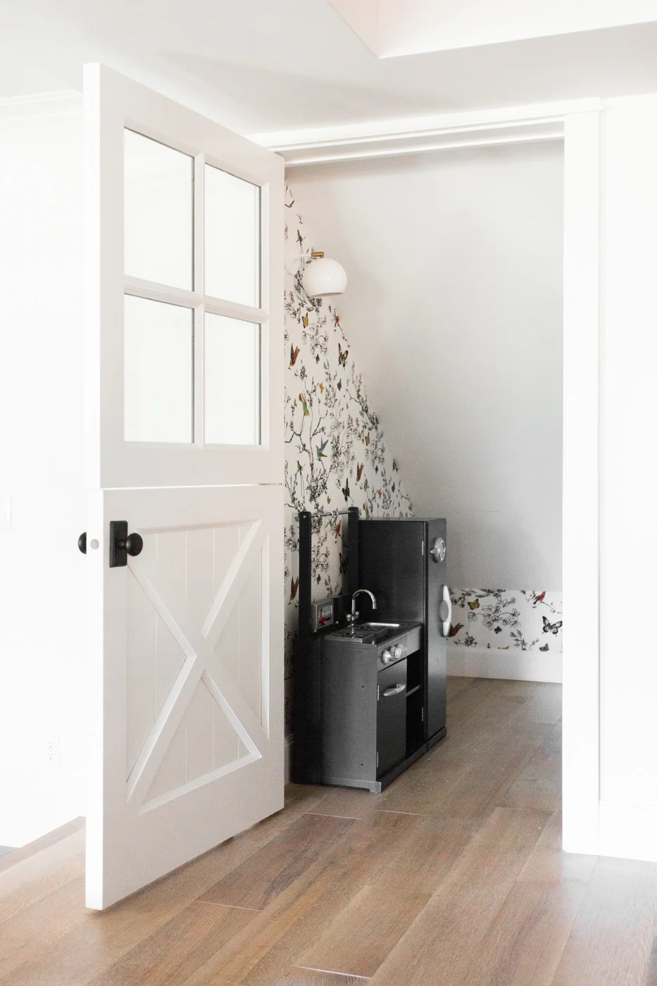 Closet+playroom+with+dutch+door+and+wallpaper+--+Studio+McGee.jpg
