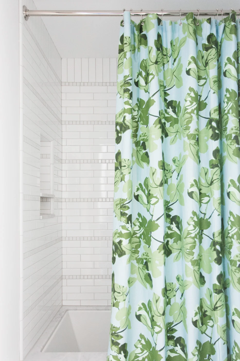Patterned+shower+curtain+and+striped+tile+detail+--+Studio+McGee.jpg