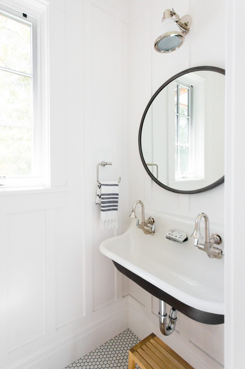 Powder+bathroom+with+black+double+sink+and+hex+floors+--+Studio+McGee.jpg