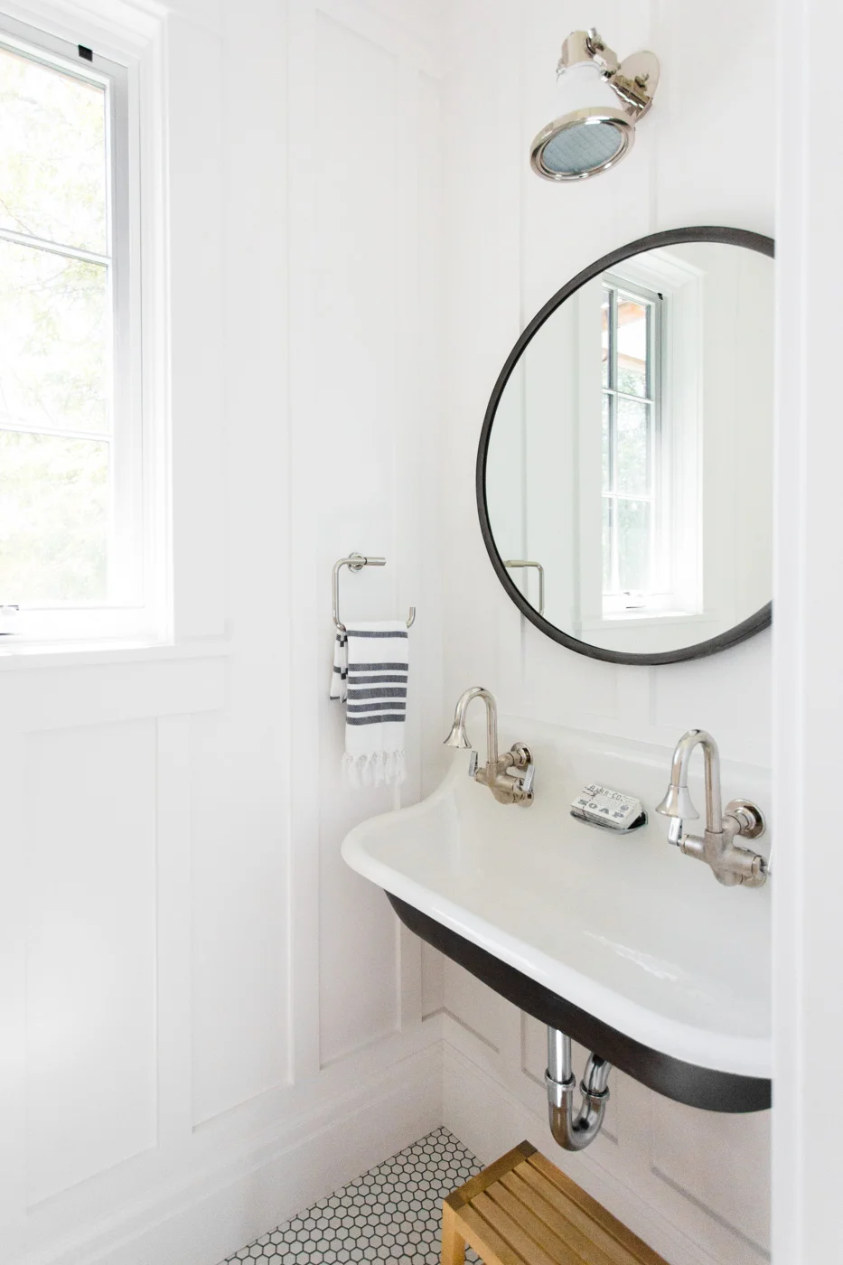Powder+bathroom+with+black+double+sink+and+hex+floors+--+Studio+McGee.jpg