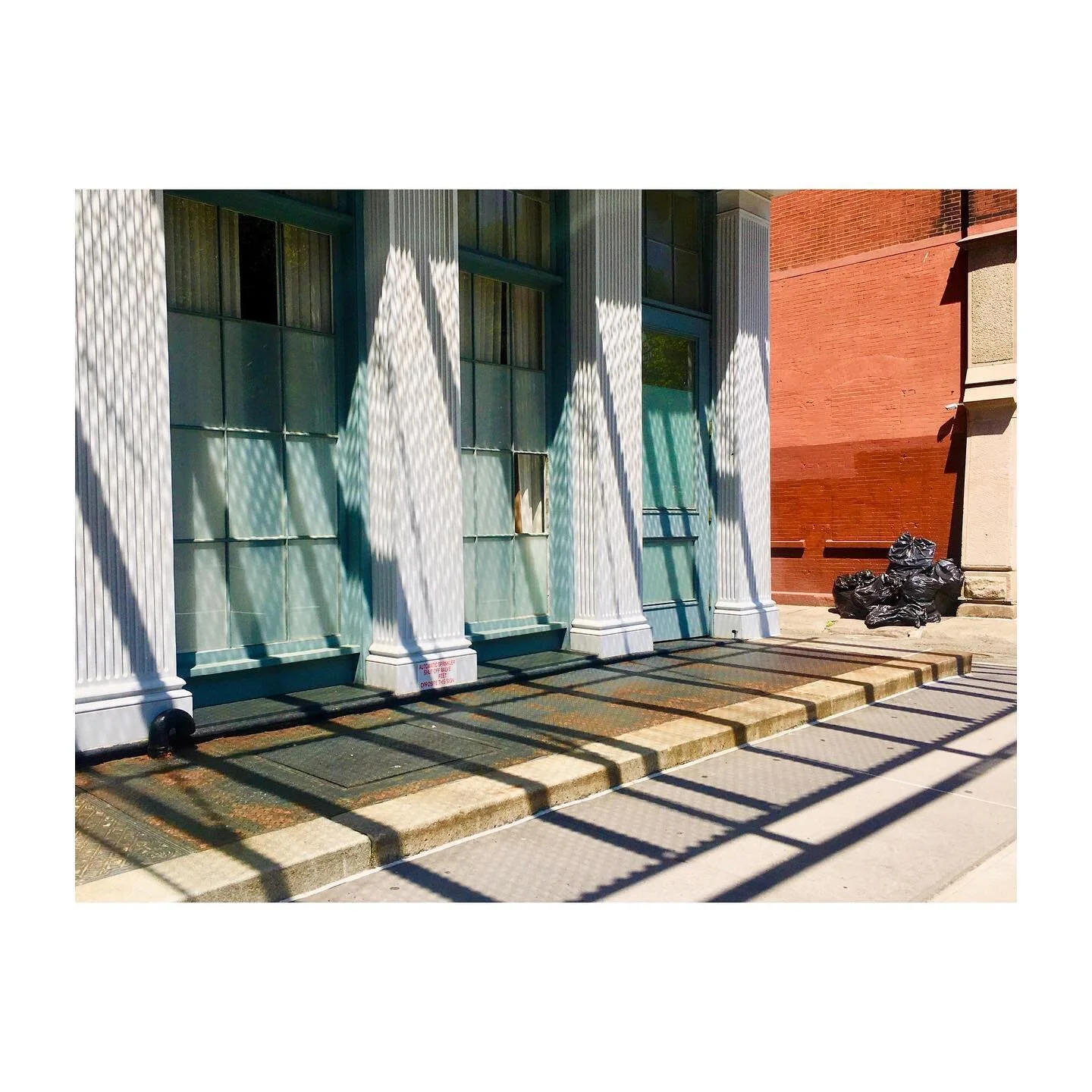 # # # #  Get a load of that criss cross #shadowplay #hashtag
✨one of my fave color combos: 🌊 &amp; 🍊
.
.
.
.
.
.
.
.
#streetphotography #doorsofinstagram #chairsofinstagram #shadowhunters #lines #archilovers #dscolor #streetfoto #finedining #garbag