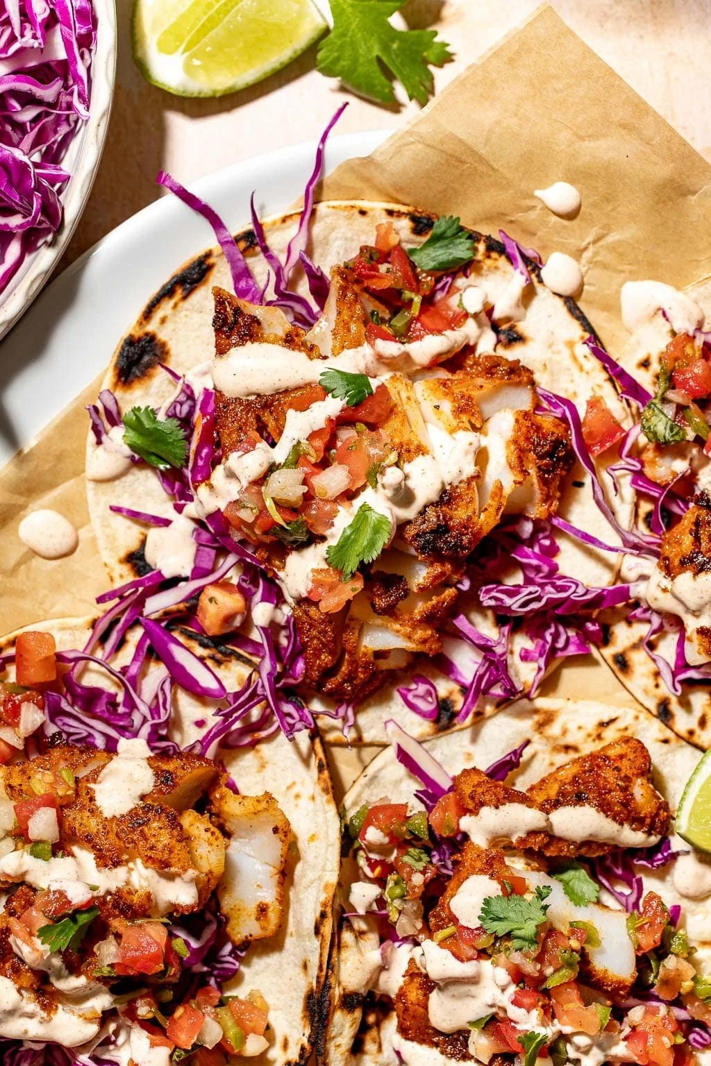 Blackened Fish Tacos with Flour Tortillas, Guacamole, Pickled Onions, & Heirloom Tomato Salad (DF)