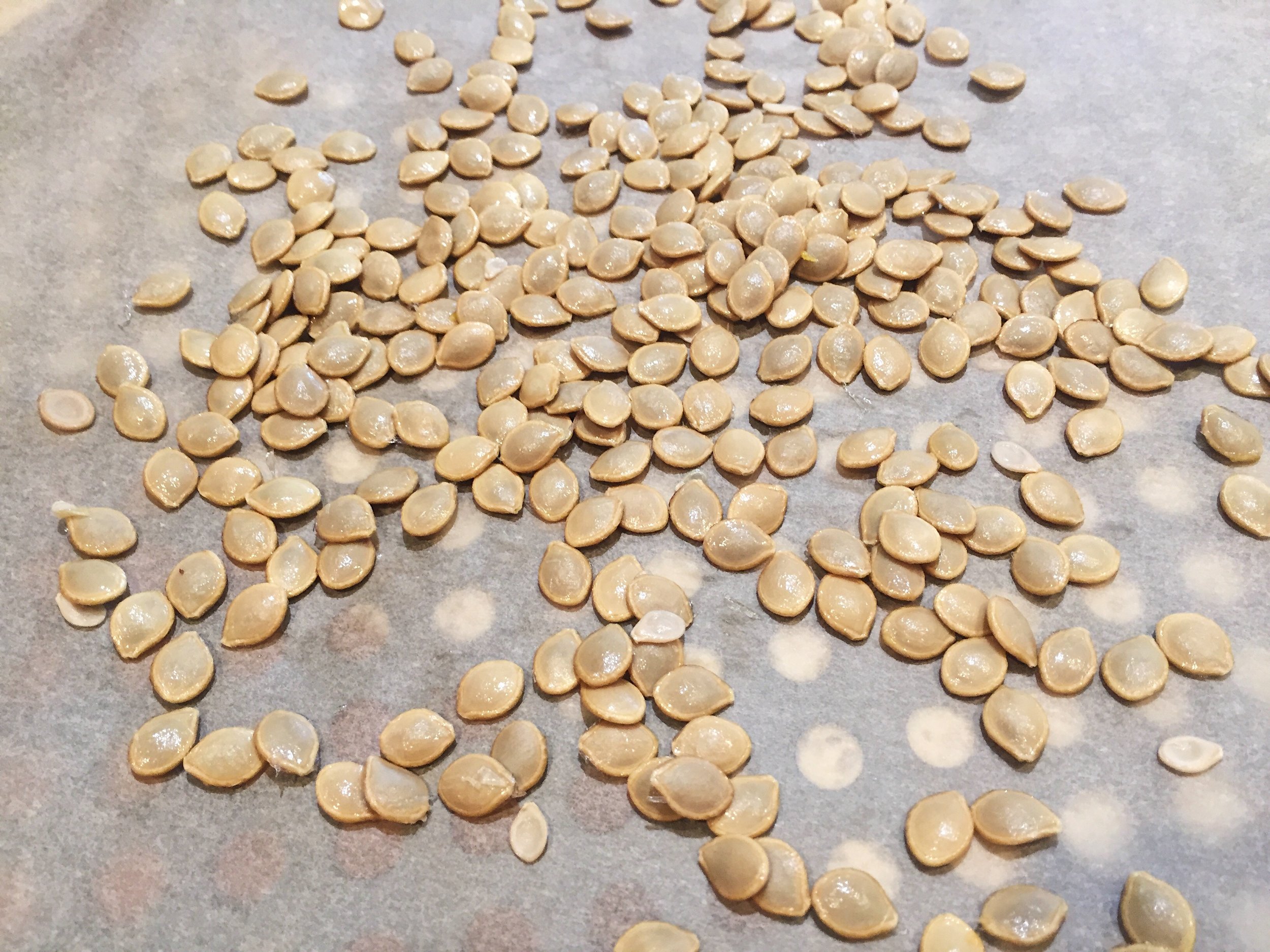  4: Place seeds in a tray with parchmeant paper and spray a little olive oil and salt. 