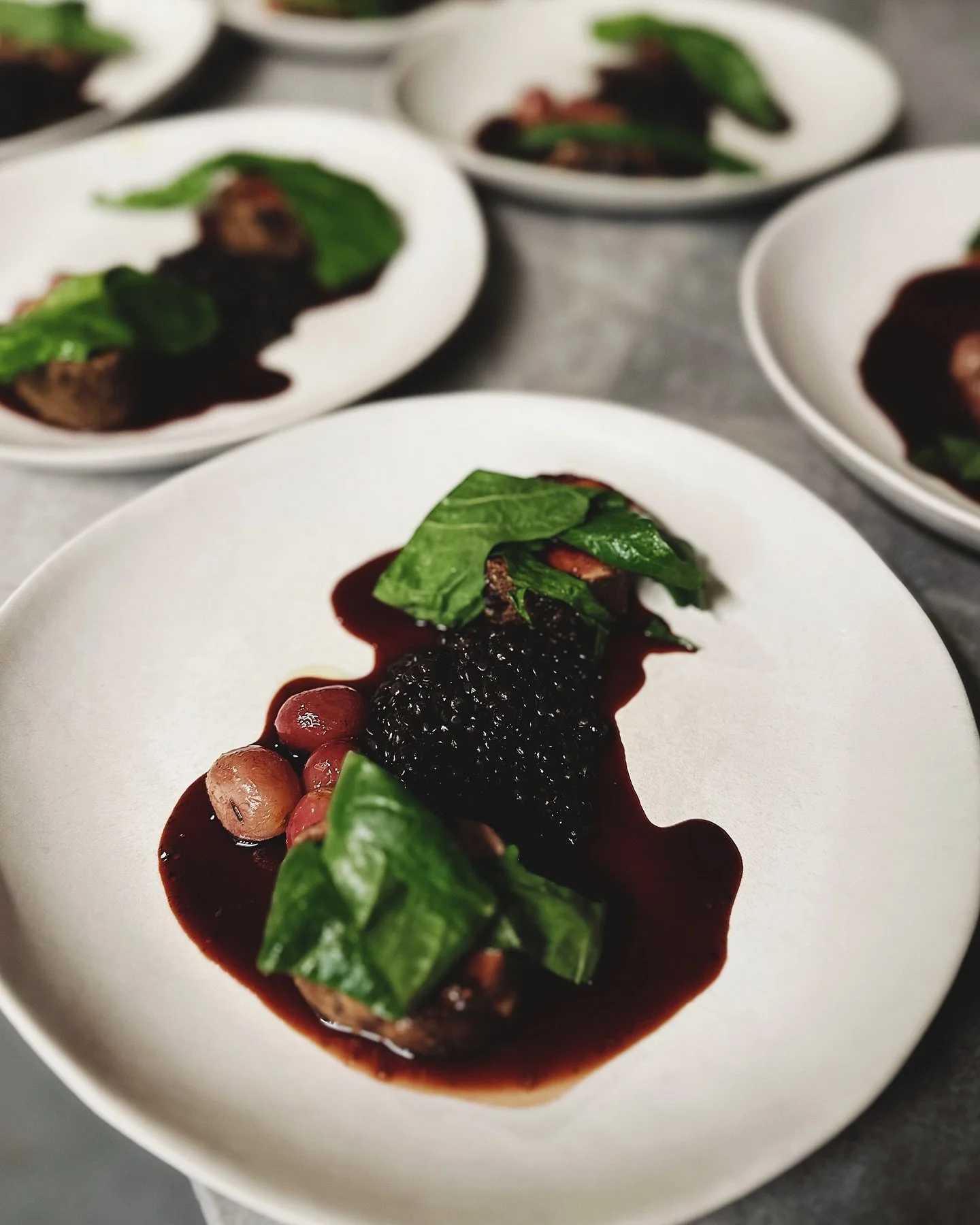 Pork tenderloin - concord jus - beluga lentils.