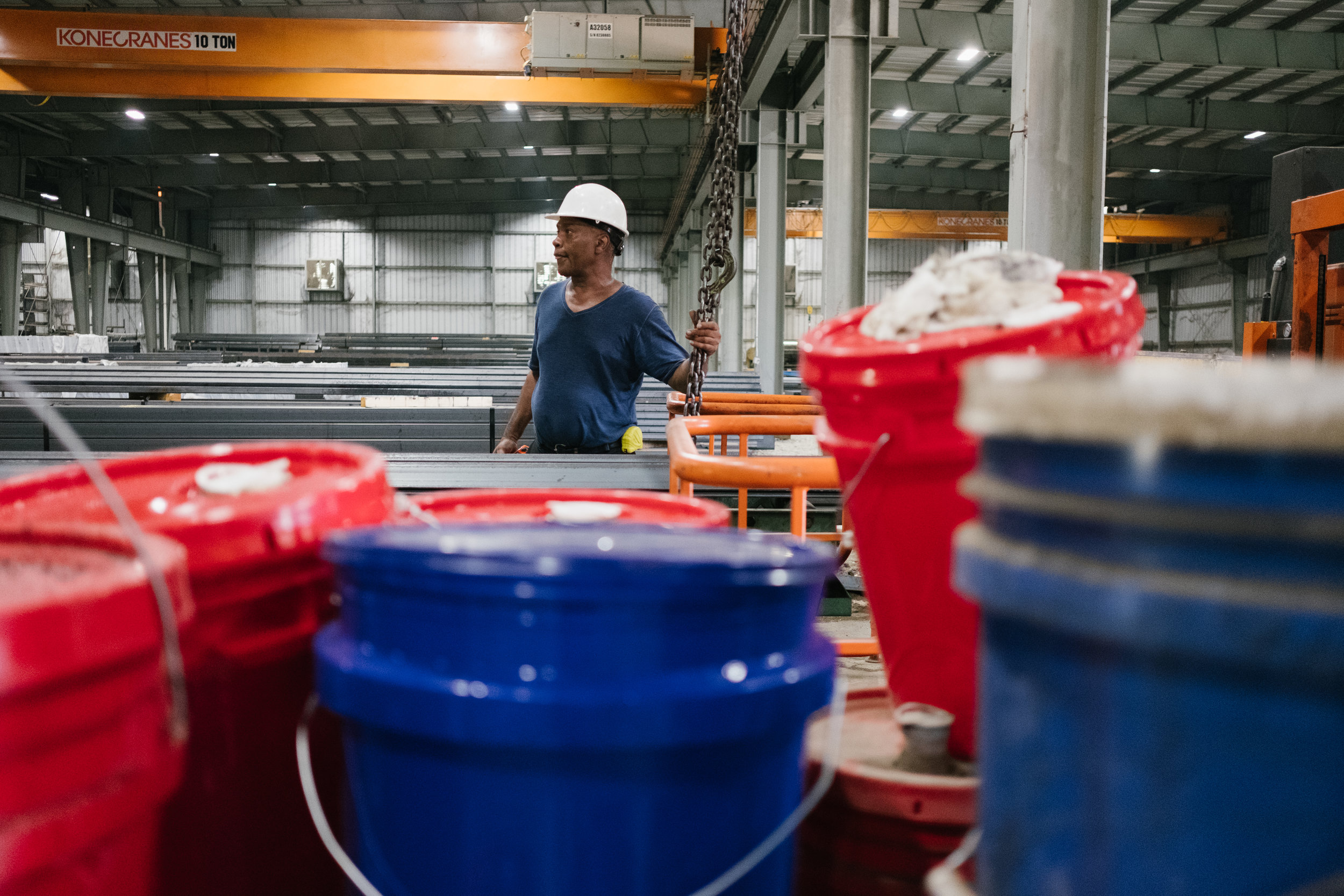  A man operates heavy machinery at Southern Steel Supply, July 18, 2018.  