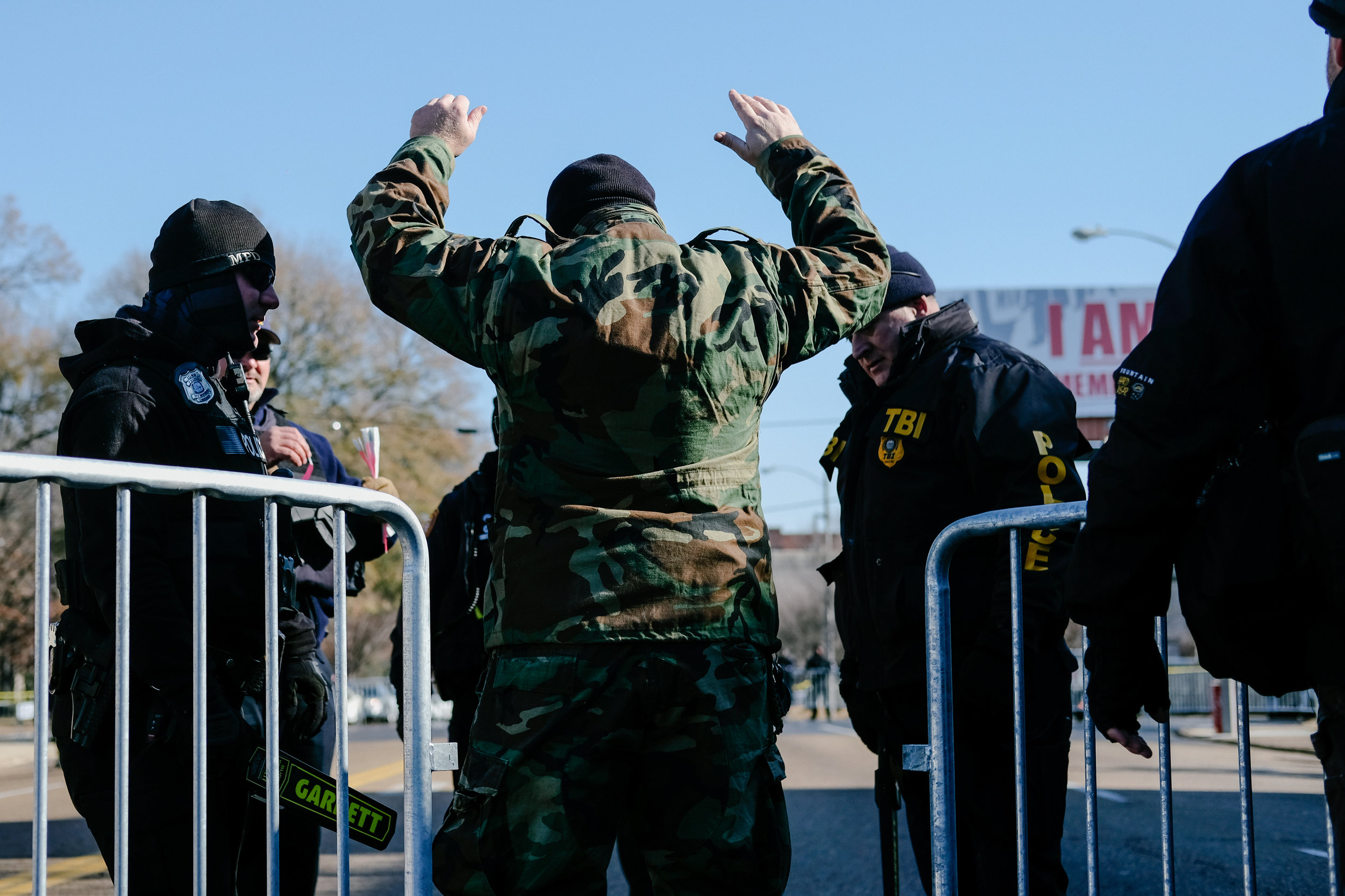 A White Nationalist protester passes through a police barricade to enter a protest by the Shield Wall Network over the removal of confederate statues in Memphis, January 6, 2018.
