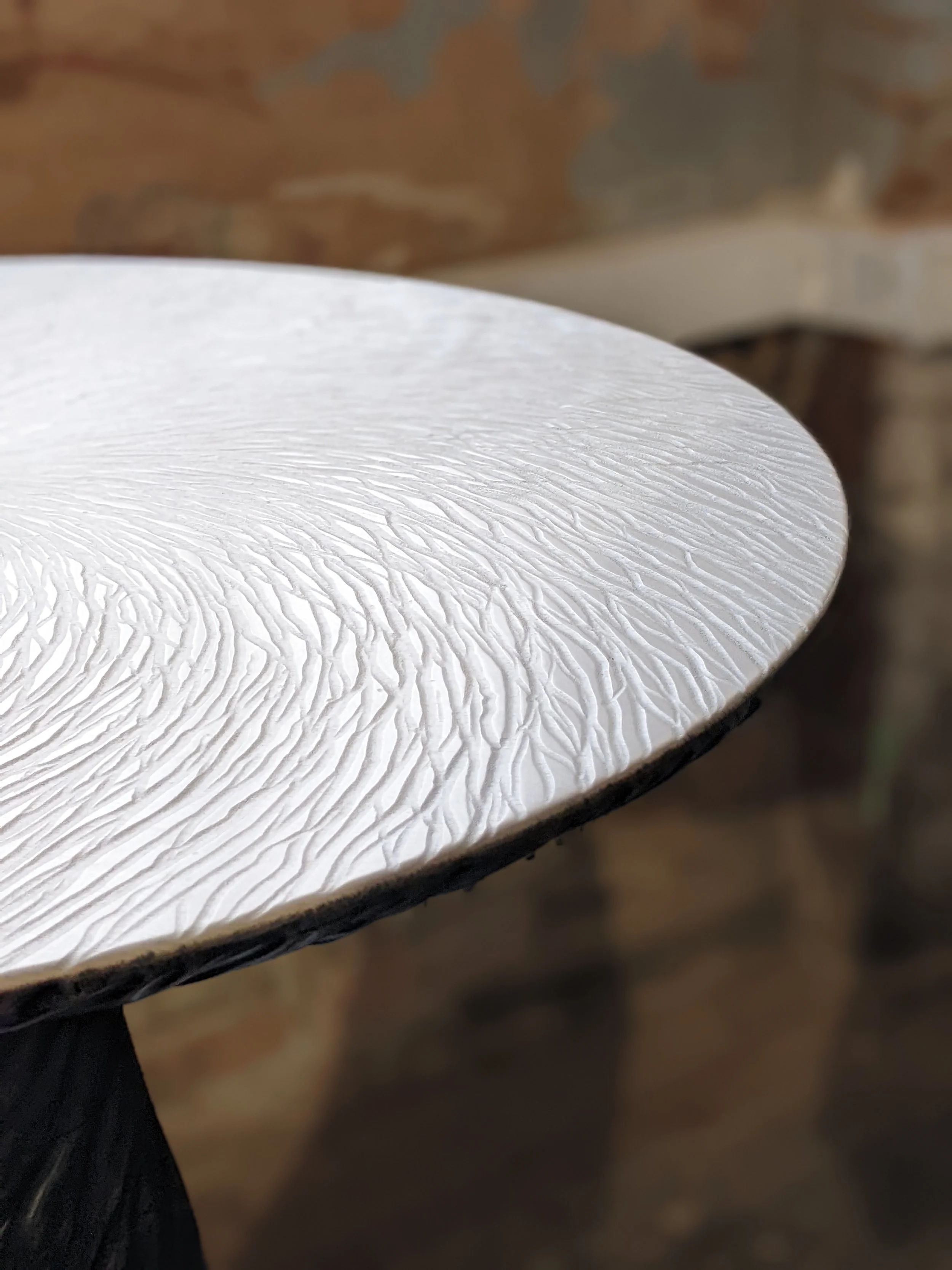 Carved surface texture of the Tourbillon table top