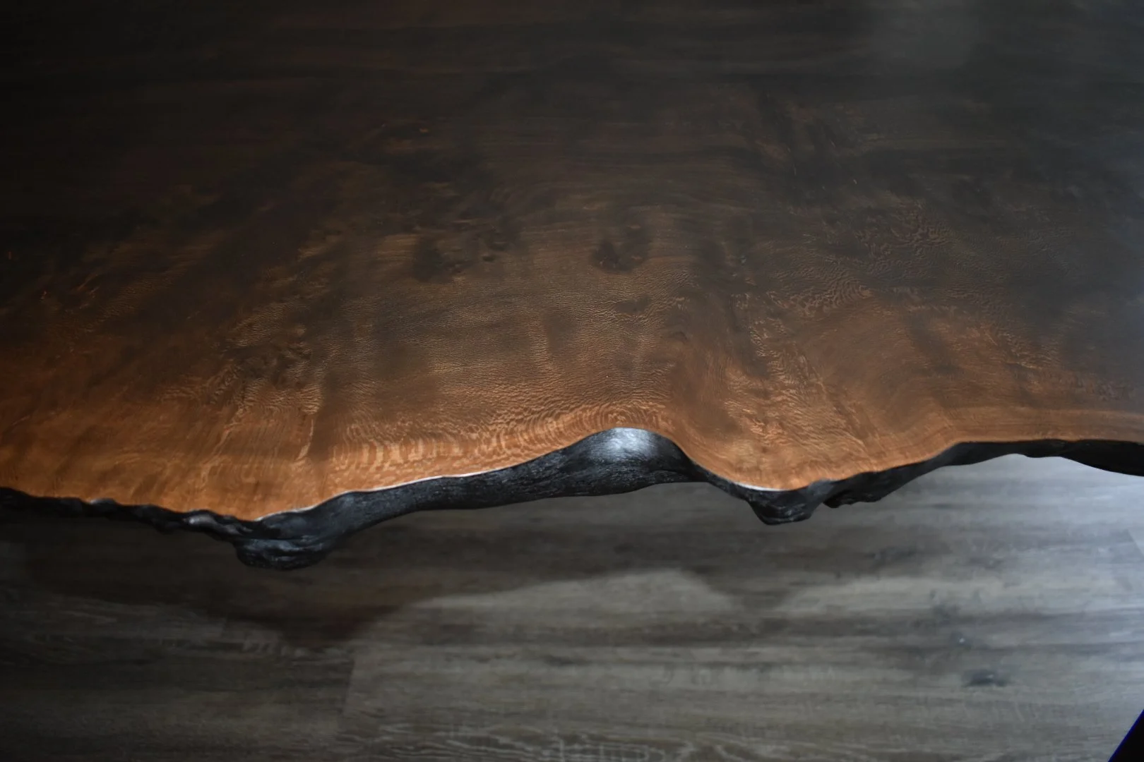 Waney ebonised london plane wood dining table edge 
