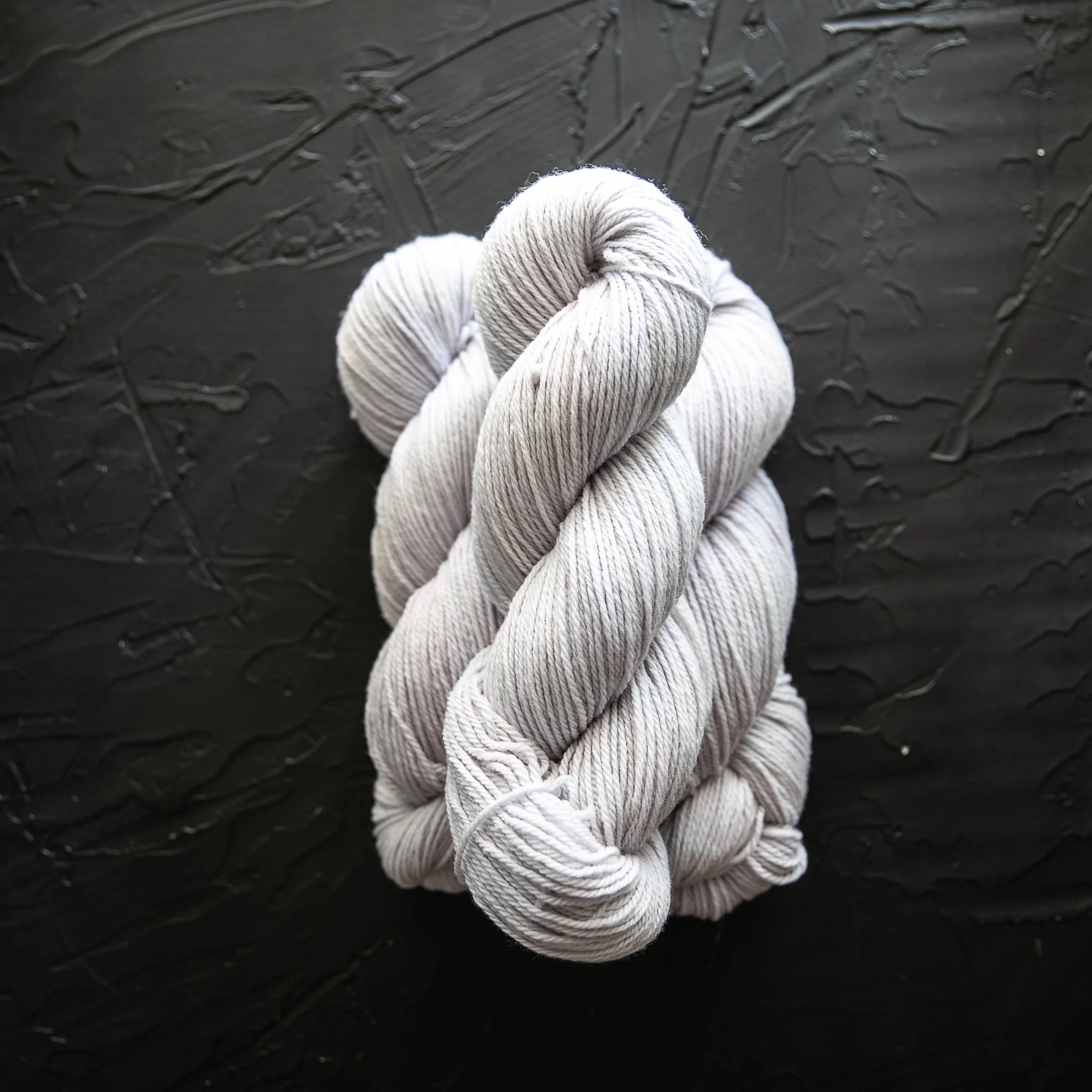 Ghost Lilac  (near-white with the faintest lilac cast) LUCKY STRIKE — Patagonia DK