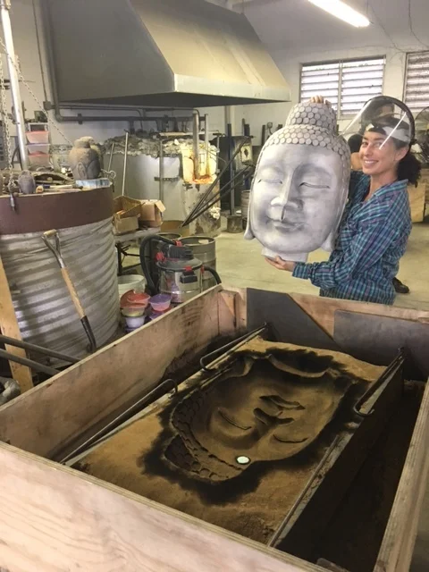 Marlene Rose removing the model from the sand mold.