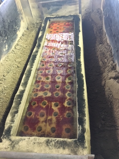 The body of the sculpture is made up of two parts - this is one half of the body. You can see that the mold has been carved down to a thin shell around the glass.