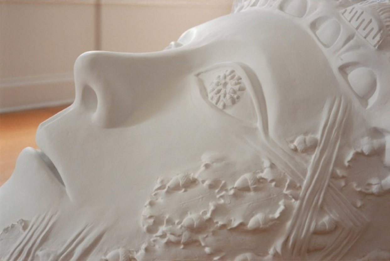 Leslie Fry. Detail from Colossal AcornHead. Modeled in plaster over a styrofoam core, integrating cast elements from architectural details into the surface. Years later this sculpture was cast in permanent bronze, now in the artist’s sculpture garden, next to her studio.