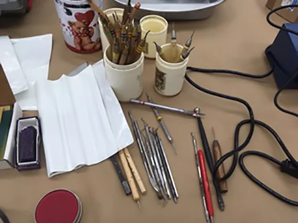 Carving tools, repair/build-up wax, and Perfect Purple wax by Kerr.