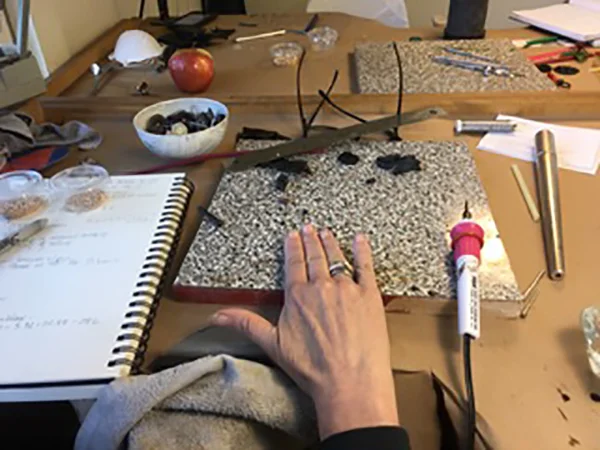 Rolling out brown wax for a ring on a granite plate. Photo courtesy of Mary Hallam Pearse.