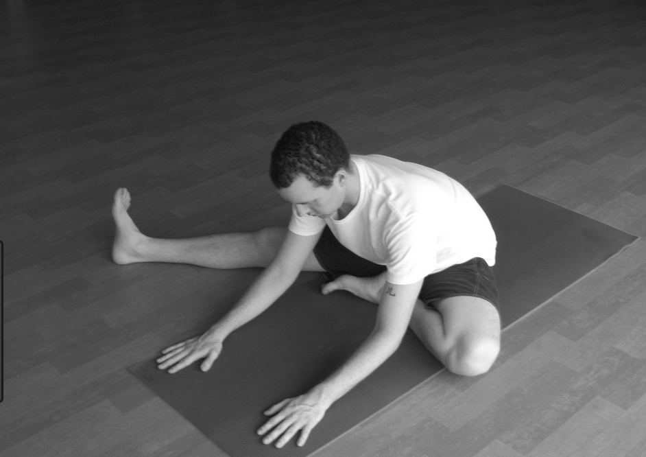 1. Sit with legs outstretched.2. Bend the right leg and place the right foot as far up on the left thigh as possible. 3. Place the right hand on top of the bent right knee.Hold the toes of the right foot with the left hand. 4. While breathing in, gently move the right knee up towards the chest. 5. Breathing out, gently push the knee down and try to touch the floor. 6. The trunk should not move. 7. Movement of leg should be achieved by the exertion of the right arm. 8. Repeat with left leg. Slowly practice about 10 up and down movements with each leg or hold in a relaxed position for 3-5 minutes. Do not strain.