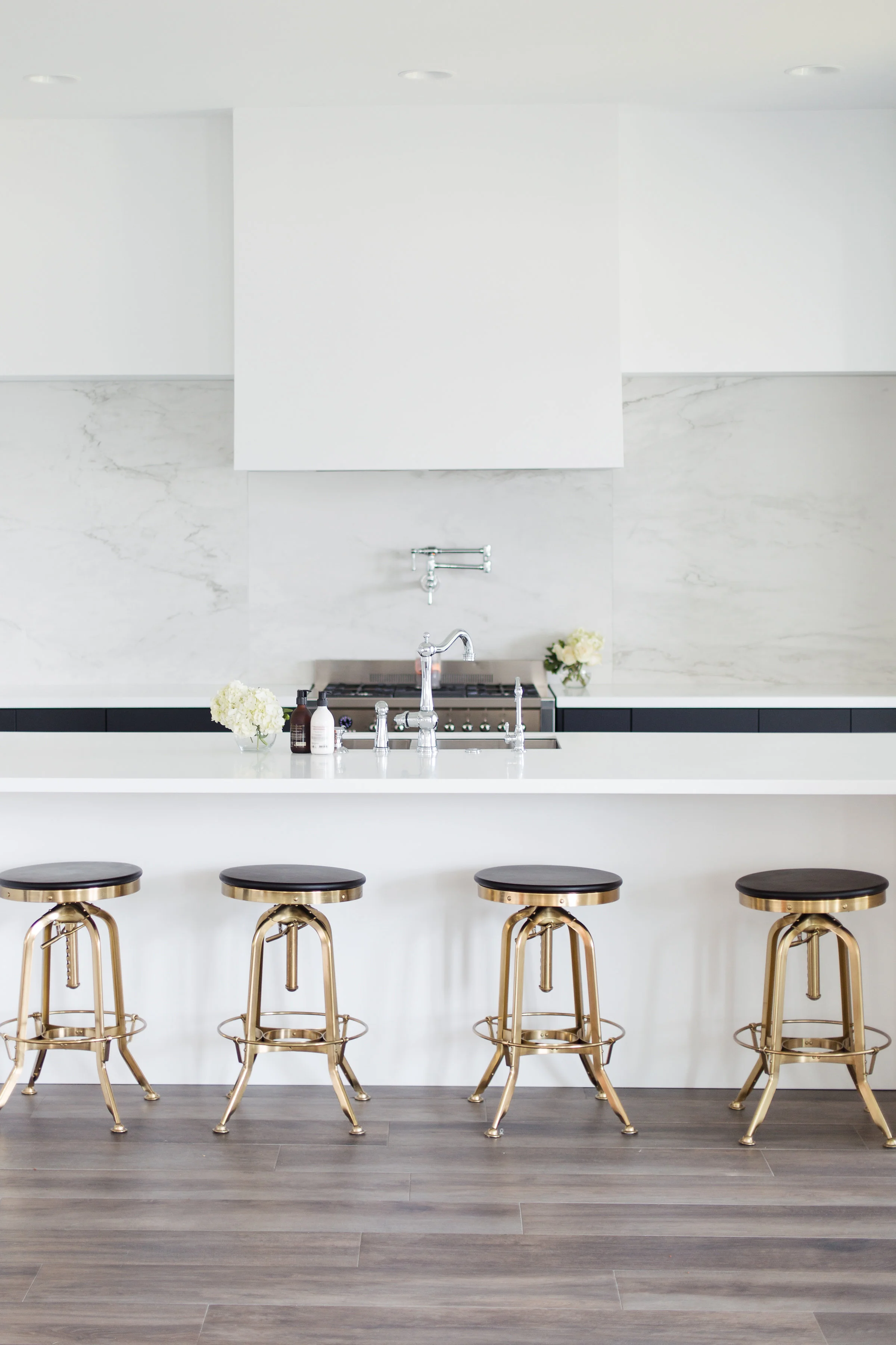 Restoration Hardware Bar Stools | Island is made of Corian in Arctic White