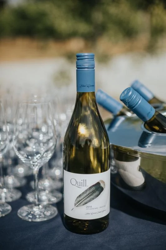 Blue Grouse offers indoor and outdoor settings for a ceremony and reception. Here, Blue Grouse Estate Winery's Quill White awaits wedding guests. Sweet Heirloom Photography.