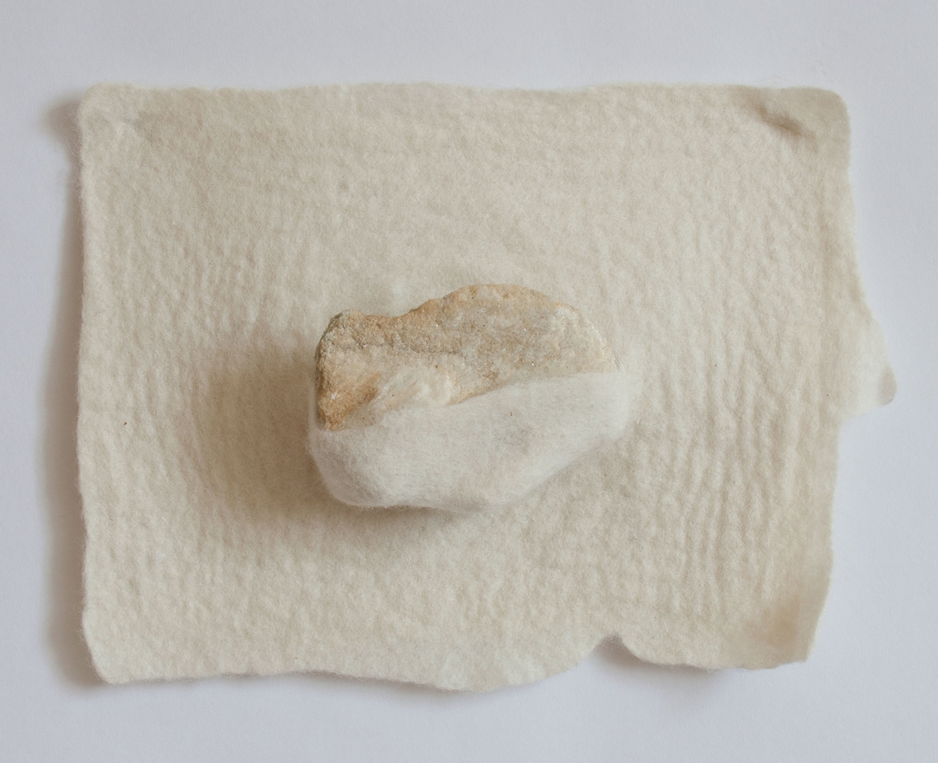  Between a rock and a soft place, 2017  Handfelted merino wool, rock 