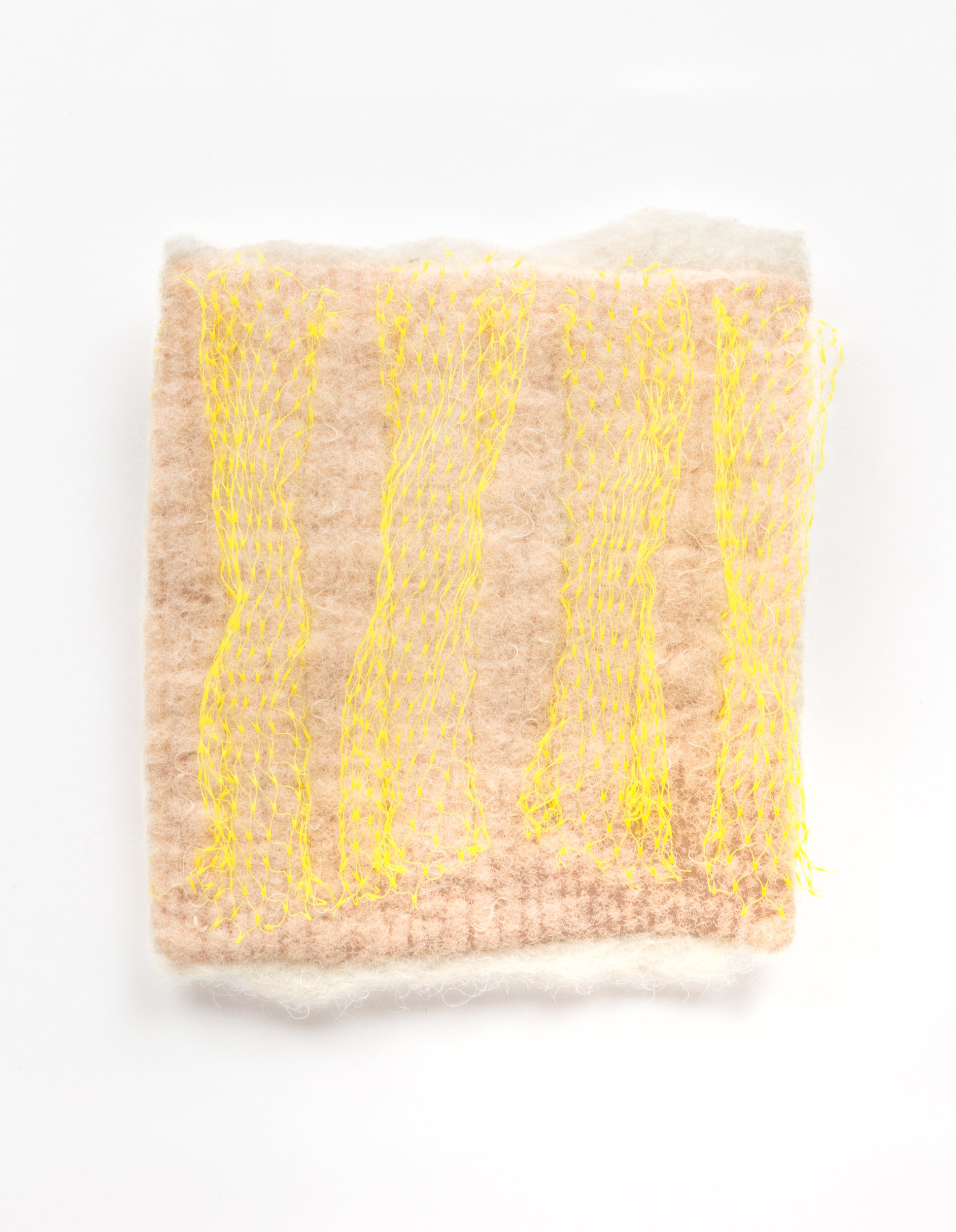  Untitled, 2023  Handfelted merino wool, plastic produce net 