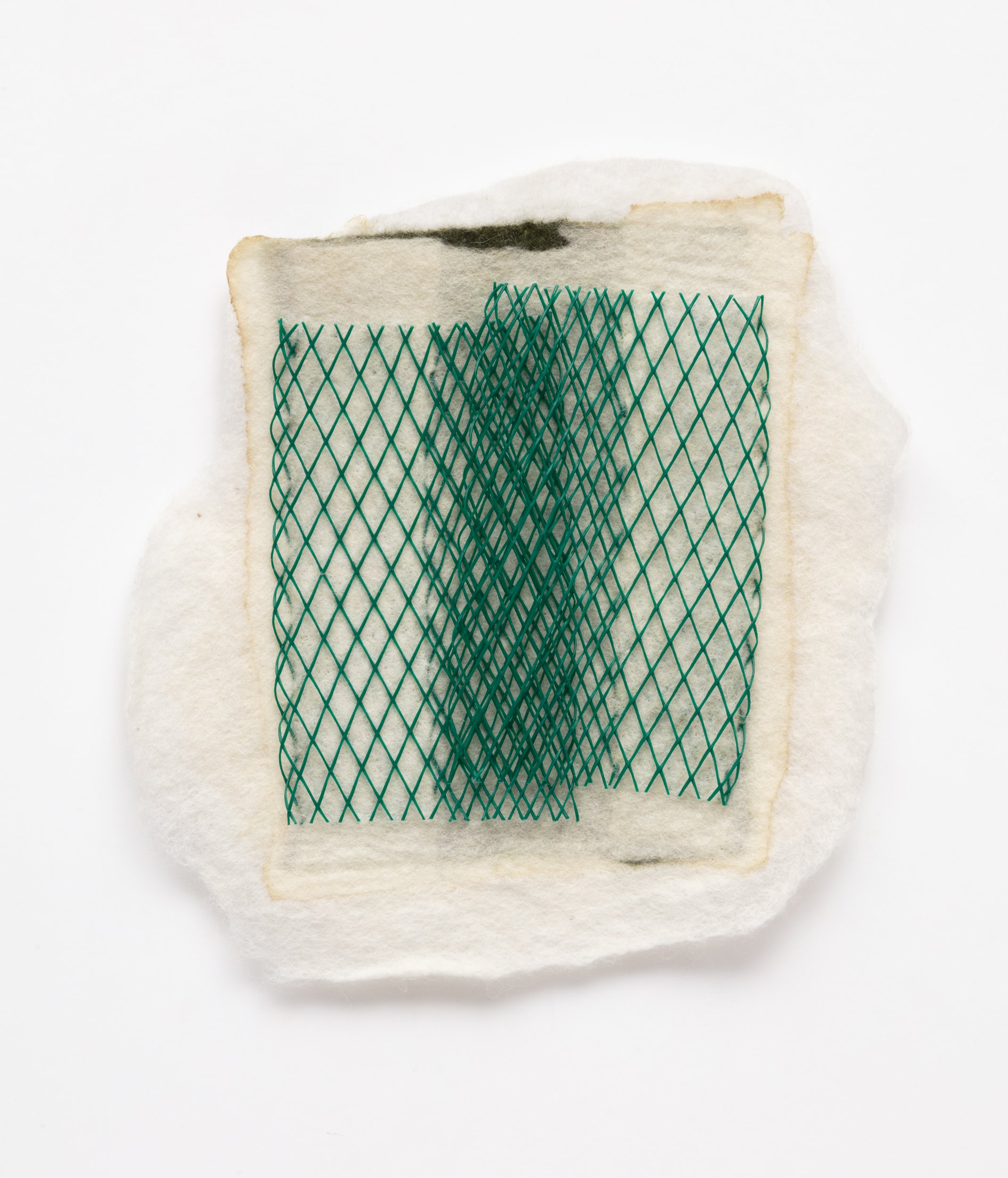  Untitled, 2023  Handfelted merino wool, plastic net packaging 
