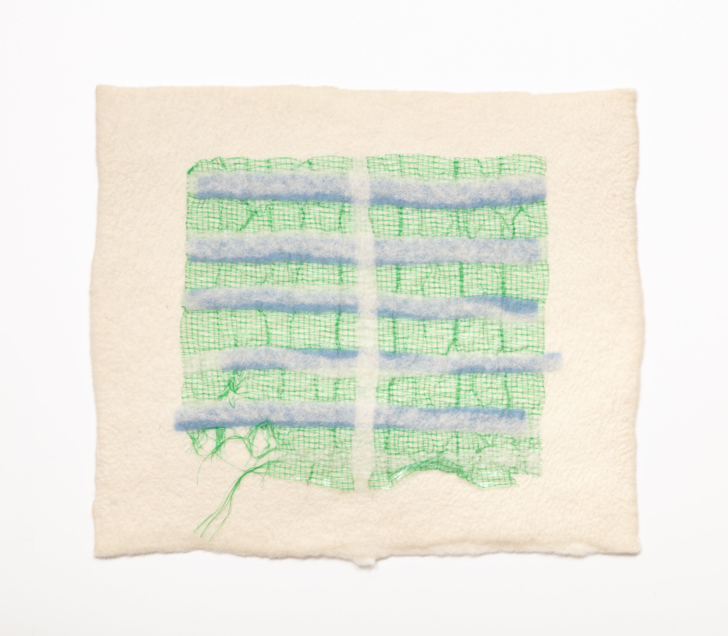  Untitled, 2024  Handfelted merino wool, plastic produce net 