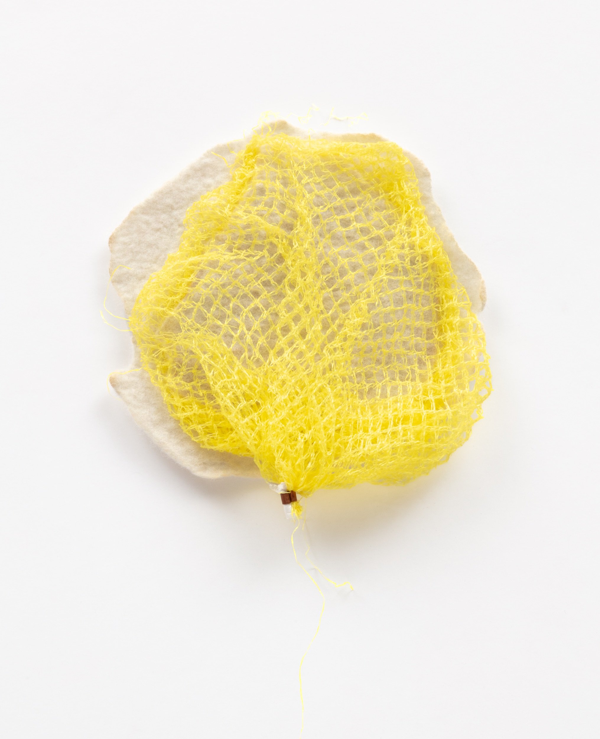  Untitled, 2021  Handfelted merino wool, plastic produce net 
